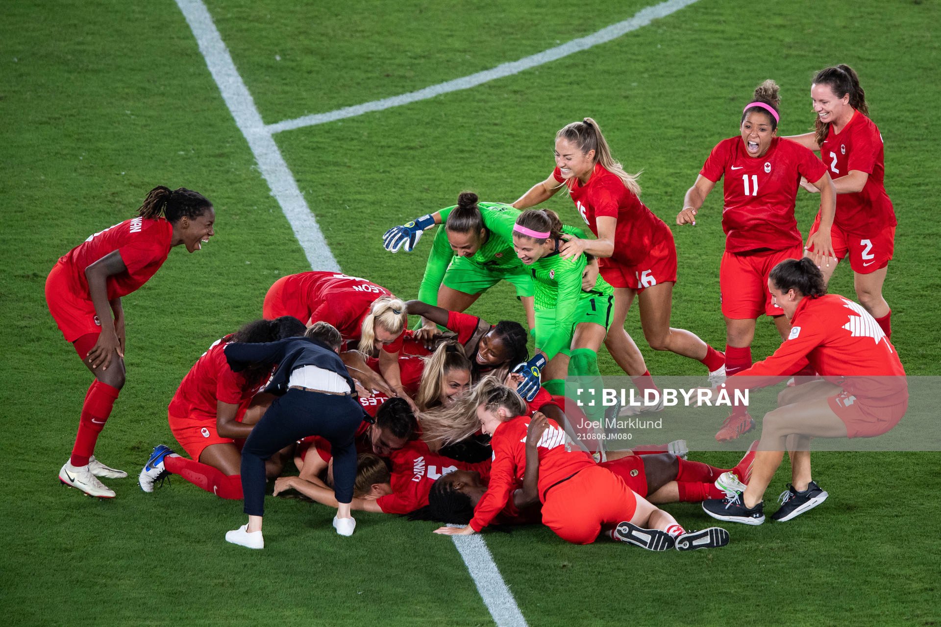 Players of Canada celebrates winning and players of Sweden