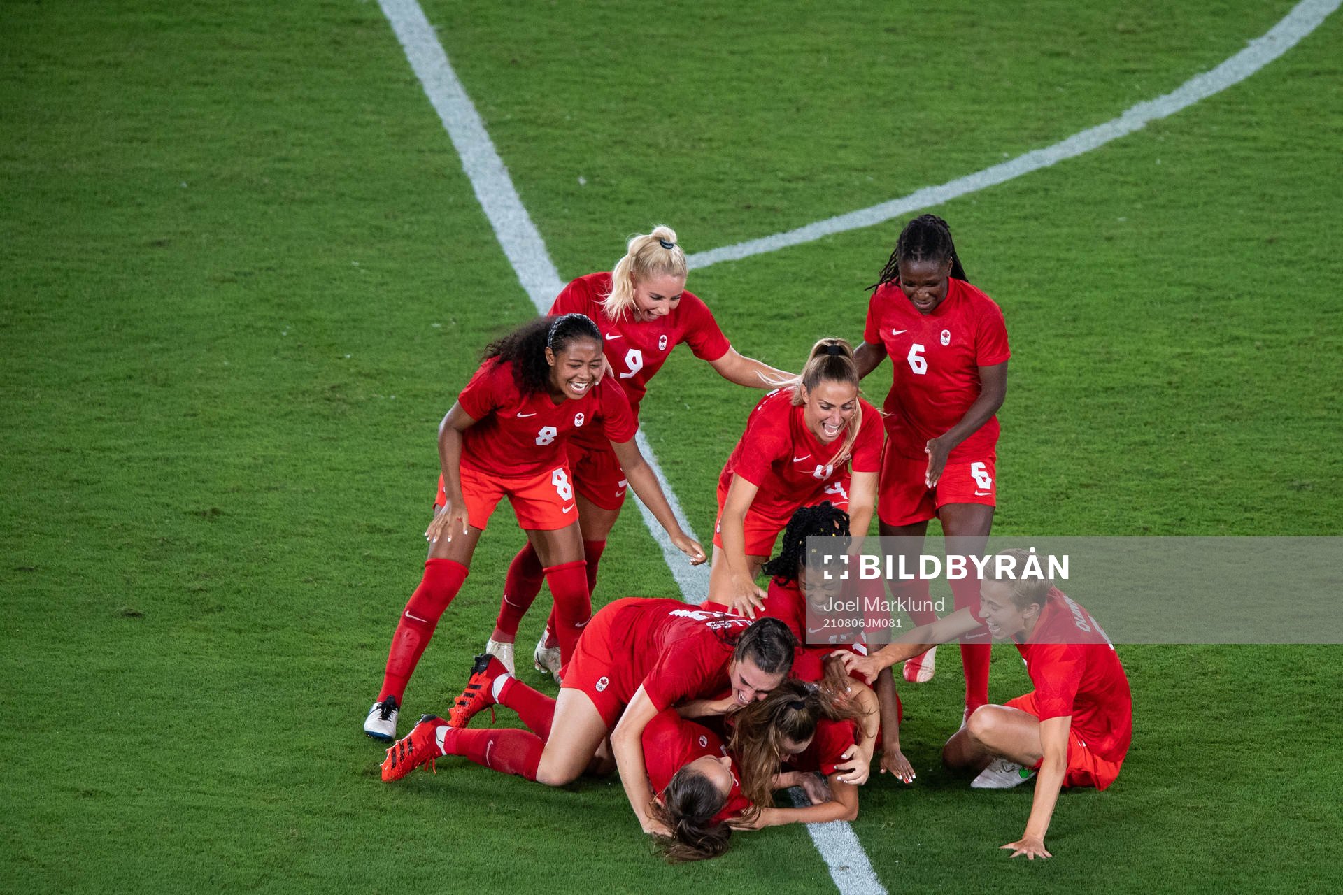 Players of Canada celebrates winning and players of Sweden