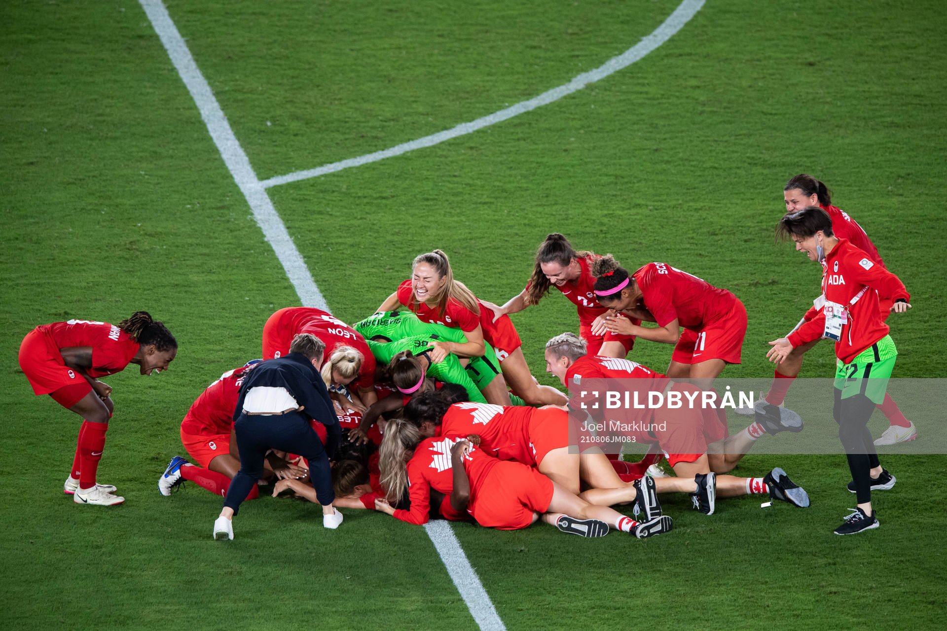 Players of Canada celebrates winning and players of Sweden