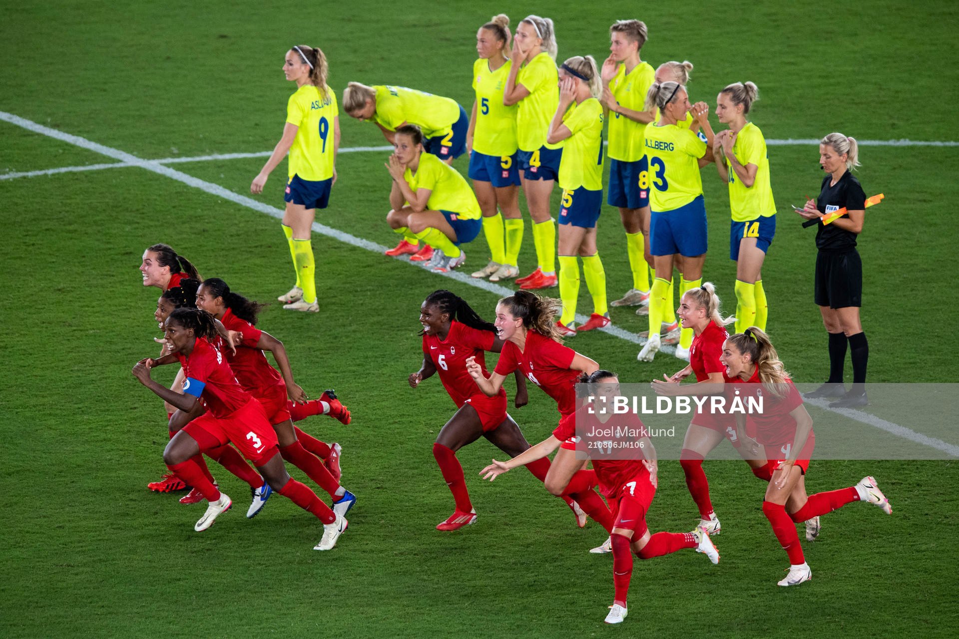 Players of Canada celebrates winning and players of Sweden