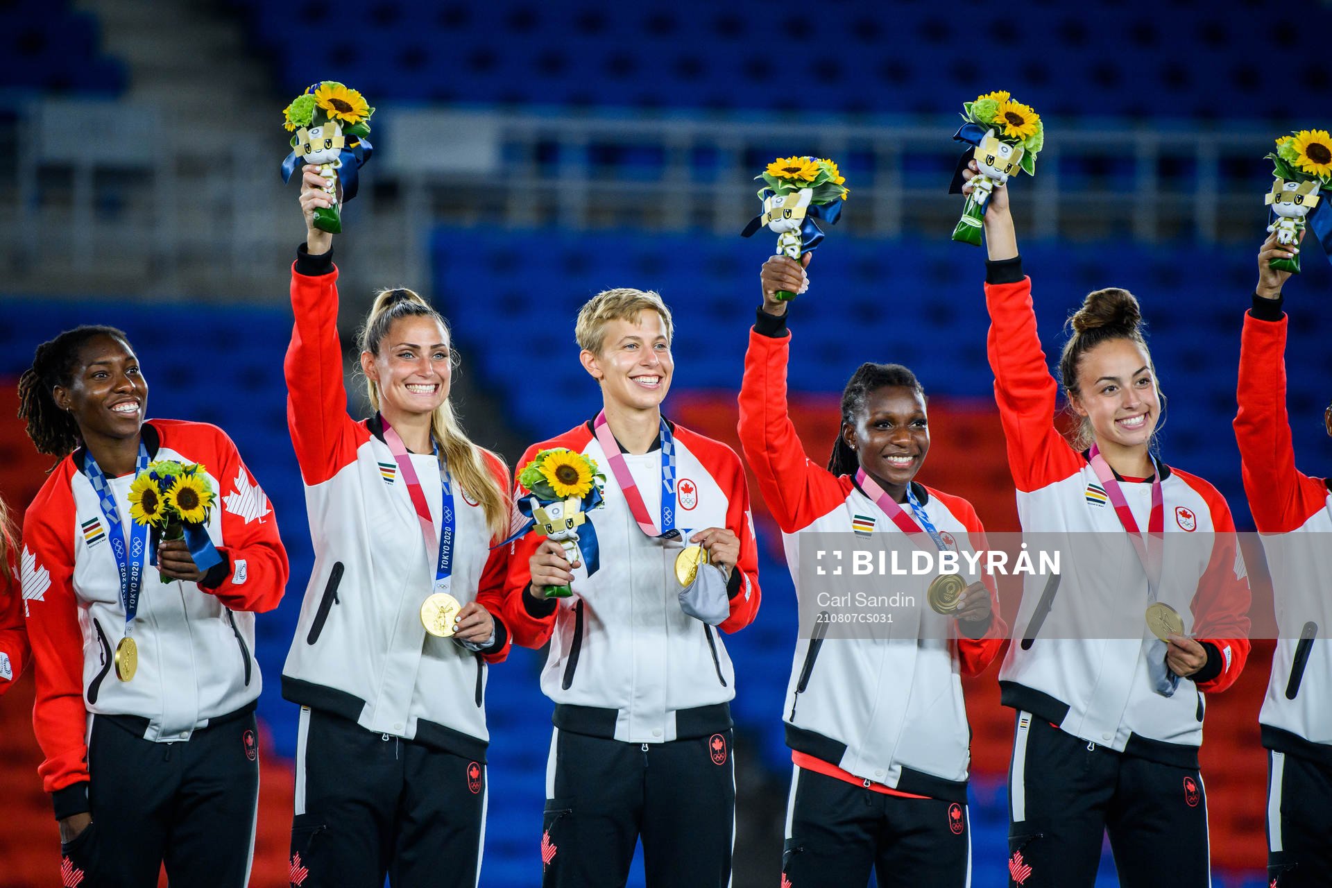 Players of Canada celebrate during the medal ceremony after the women’s football final during day 14 of the Tokyo 2020 Olympic Games on August 6, 2021 in Tokyo.