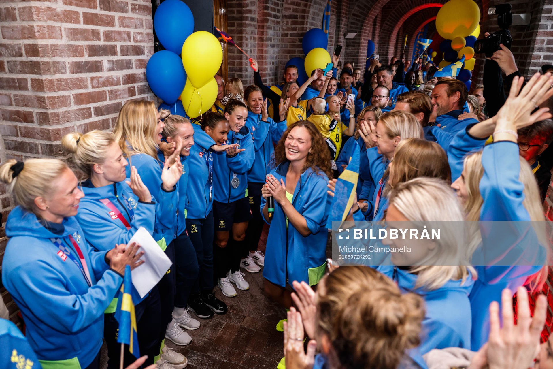 Players of the Swedish football team celebrate at a press meet after their return from the Tokyo 2020 Olympic Games on August 7, 2021 in Tokyo.
