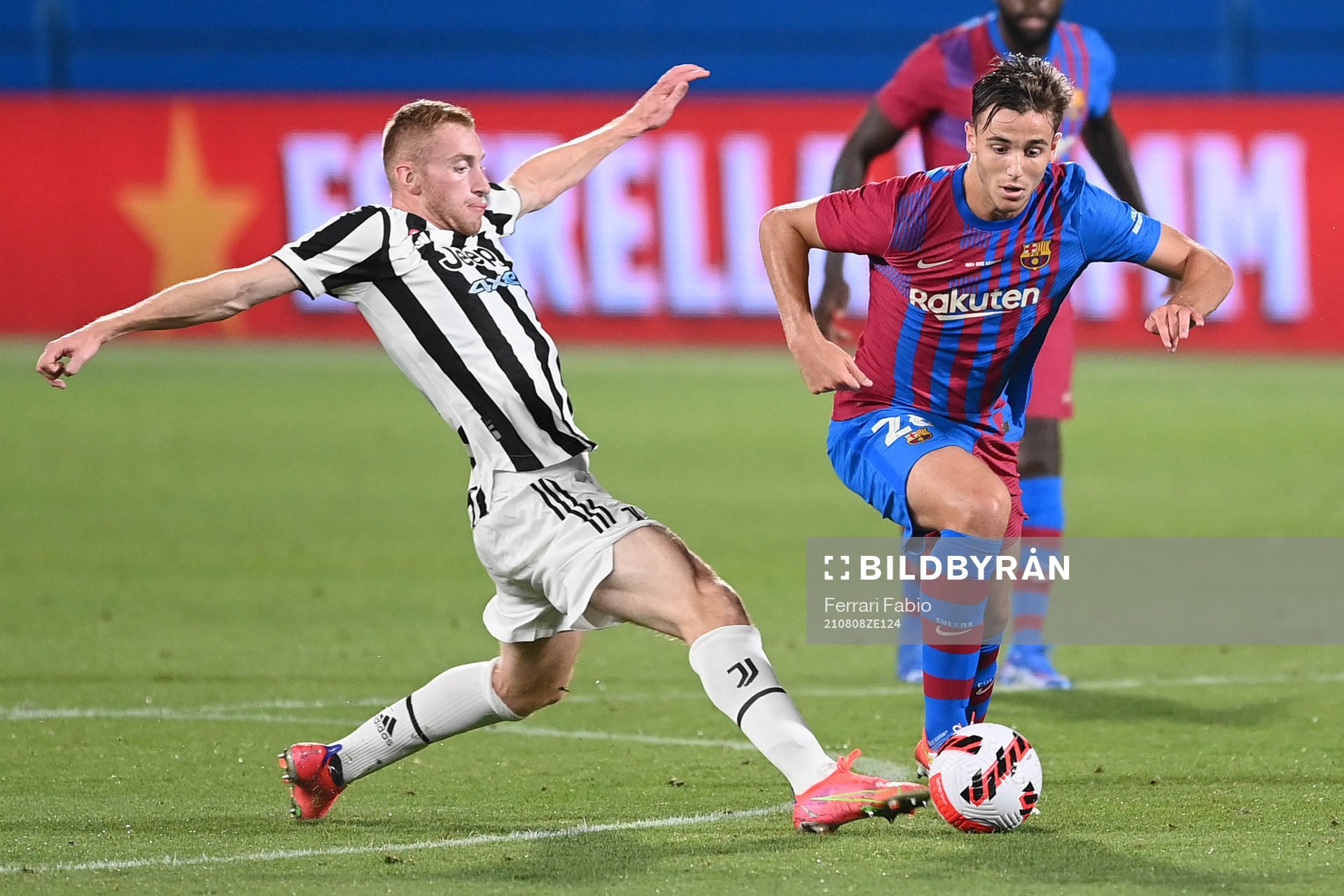 Dejan Kulusevski of Juventus and Nico González of Barcelona during a friendly match between Juventus and Barcelona on August 2, 2021 in Barcelona.