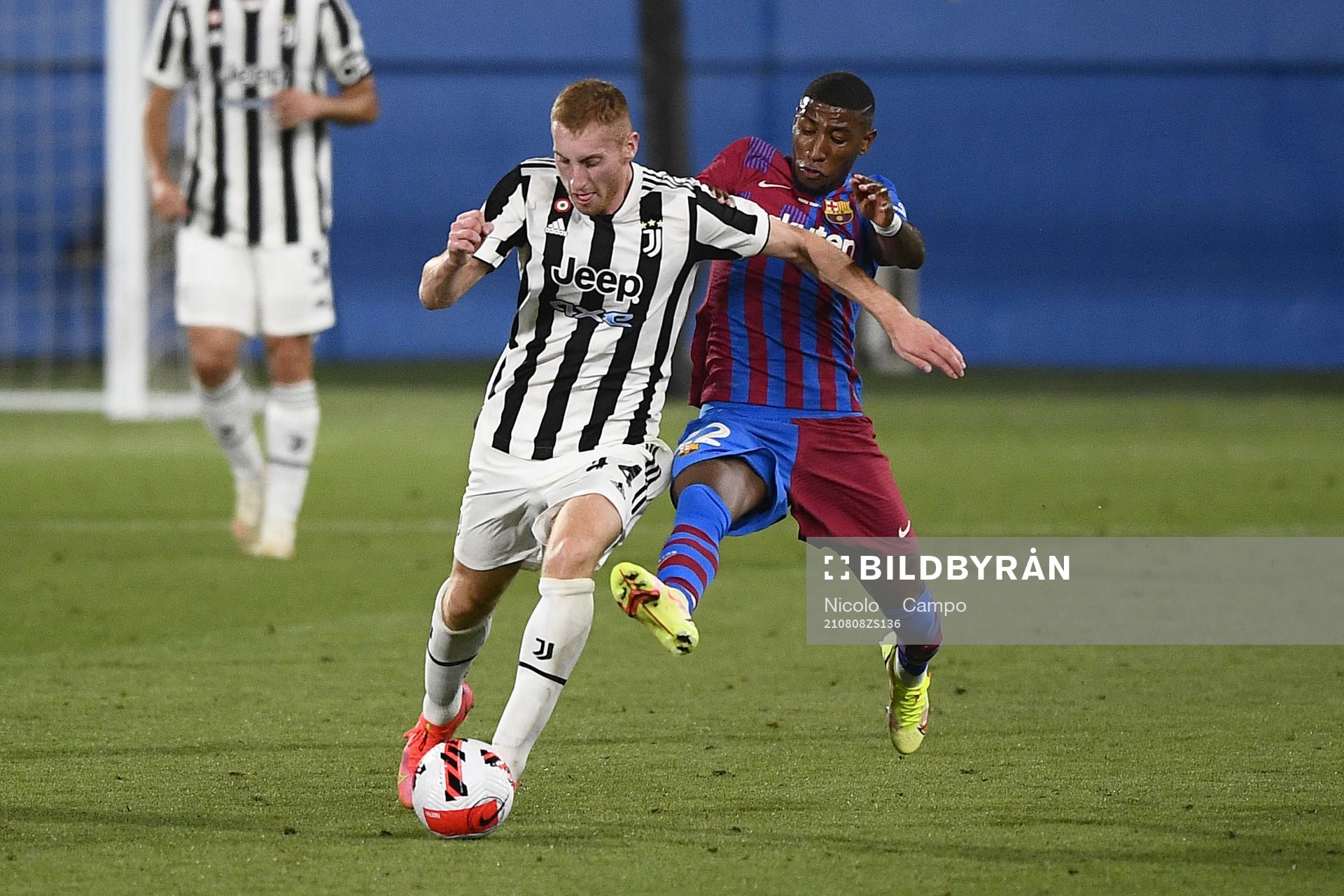 Emerson of Barcelona and Dejan Kulusevski of Juventus