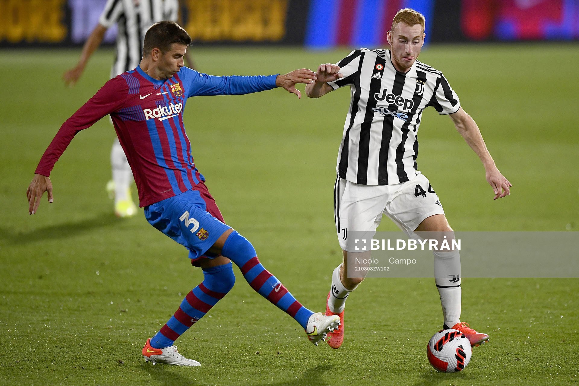 Gerard Piqué of Barcelona and Dejan Kulusevski of Juventus