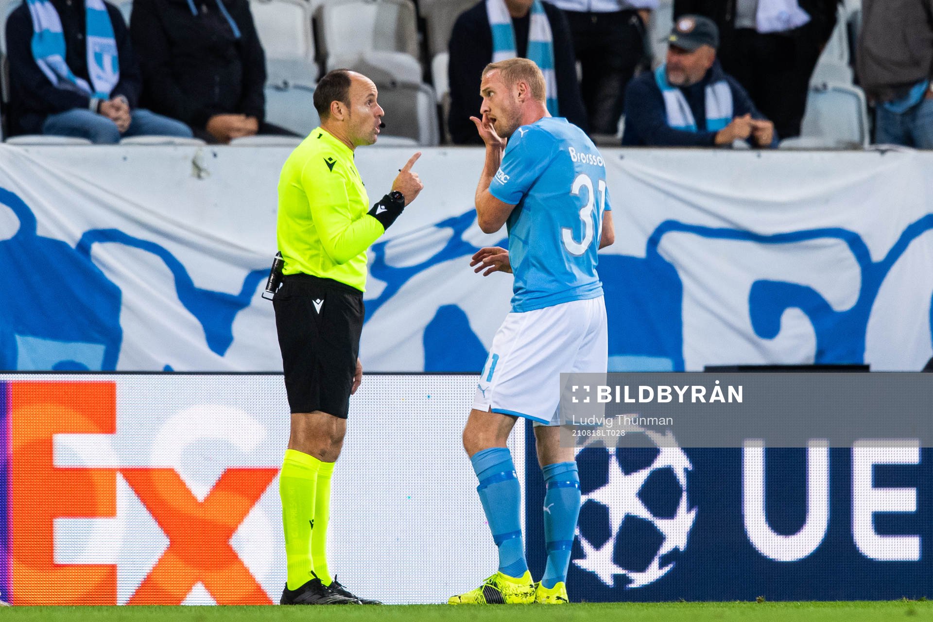 Referee Antonio Mateu Lahoz talks to Franz Brorsson of