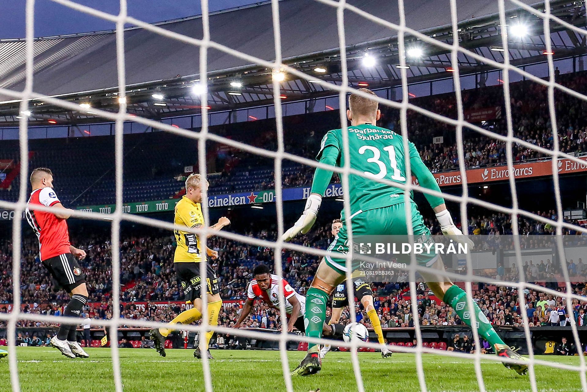 Luis Sinisterra off Feyenoord scores behind goalkeeper Tim