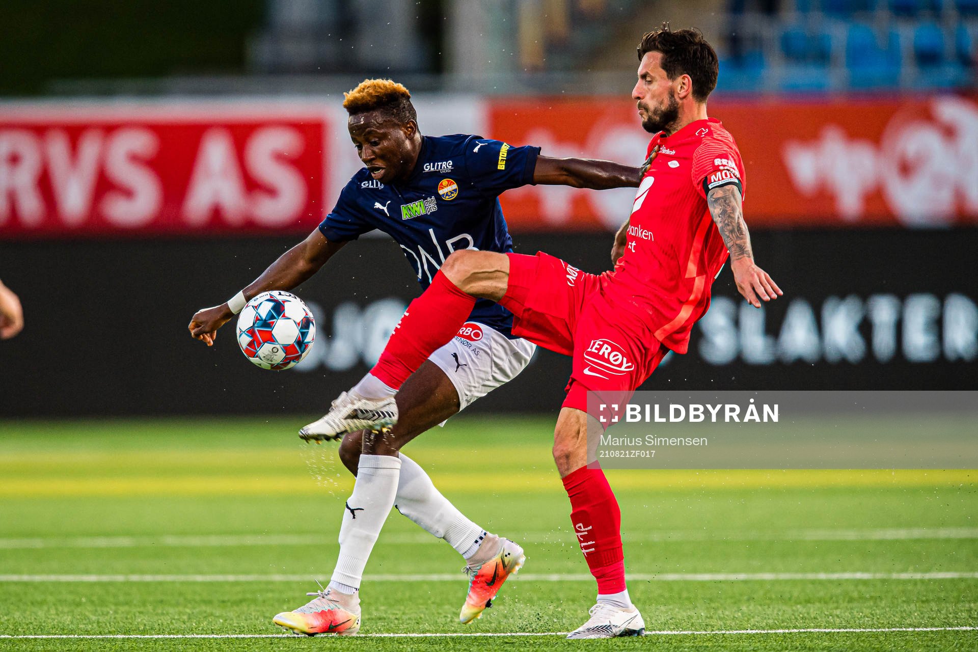 Ipalibo Jack of Strømsgodset and Daniel Alexander Pedersen of Brann during the Eliteserien match between Strømsgodset and Brann on August 21, 2021 in Drammen.