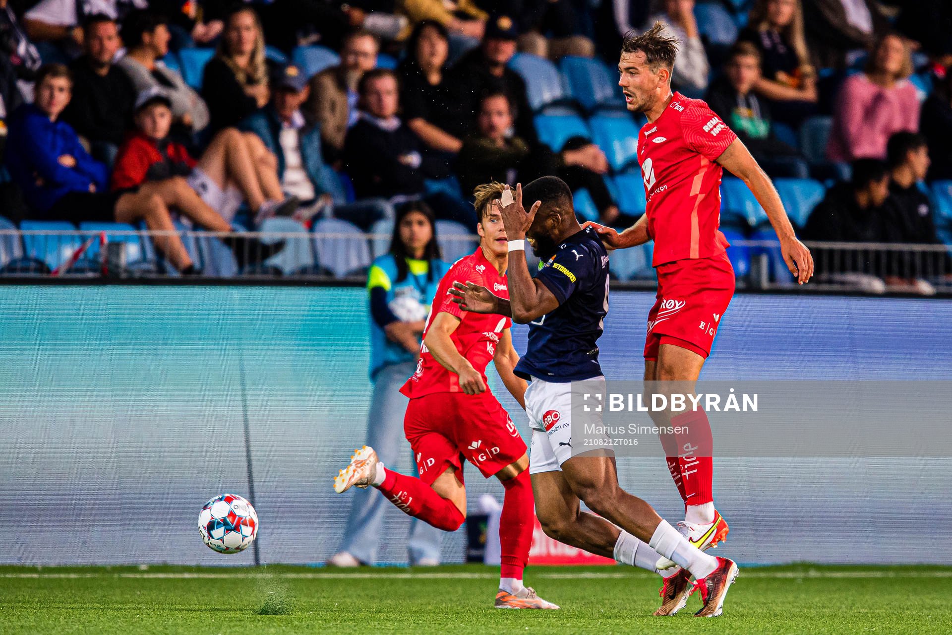 Imoh Fred Friday of Strømsgodset and Fredrik Pallesen Knudsen of Brann during the Eliteserien match between Strømsgodset and Brann on August 21, 2021 in Drammen.