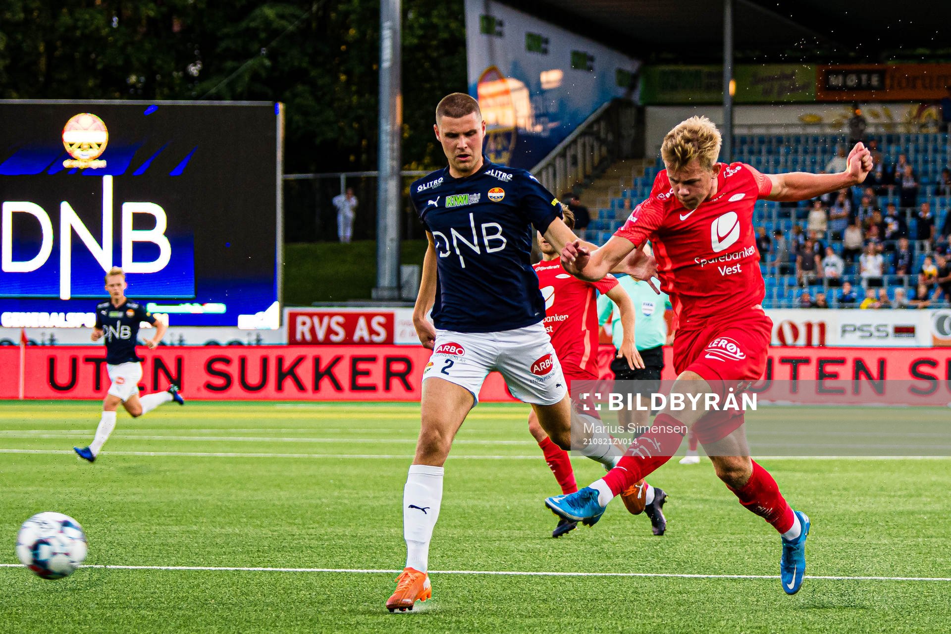 Ari Leifsson of Strømsgodset and Aune Selland Heggebø of Brann during the Eliteserien match between Strømsgodset and Brann on August 21, 2021 in Drammen.