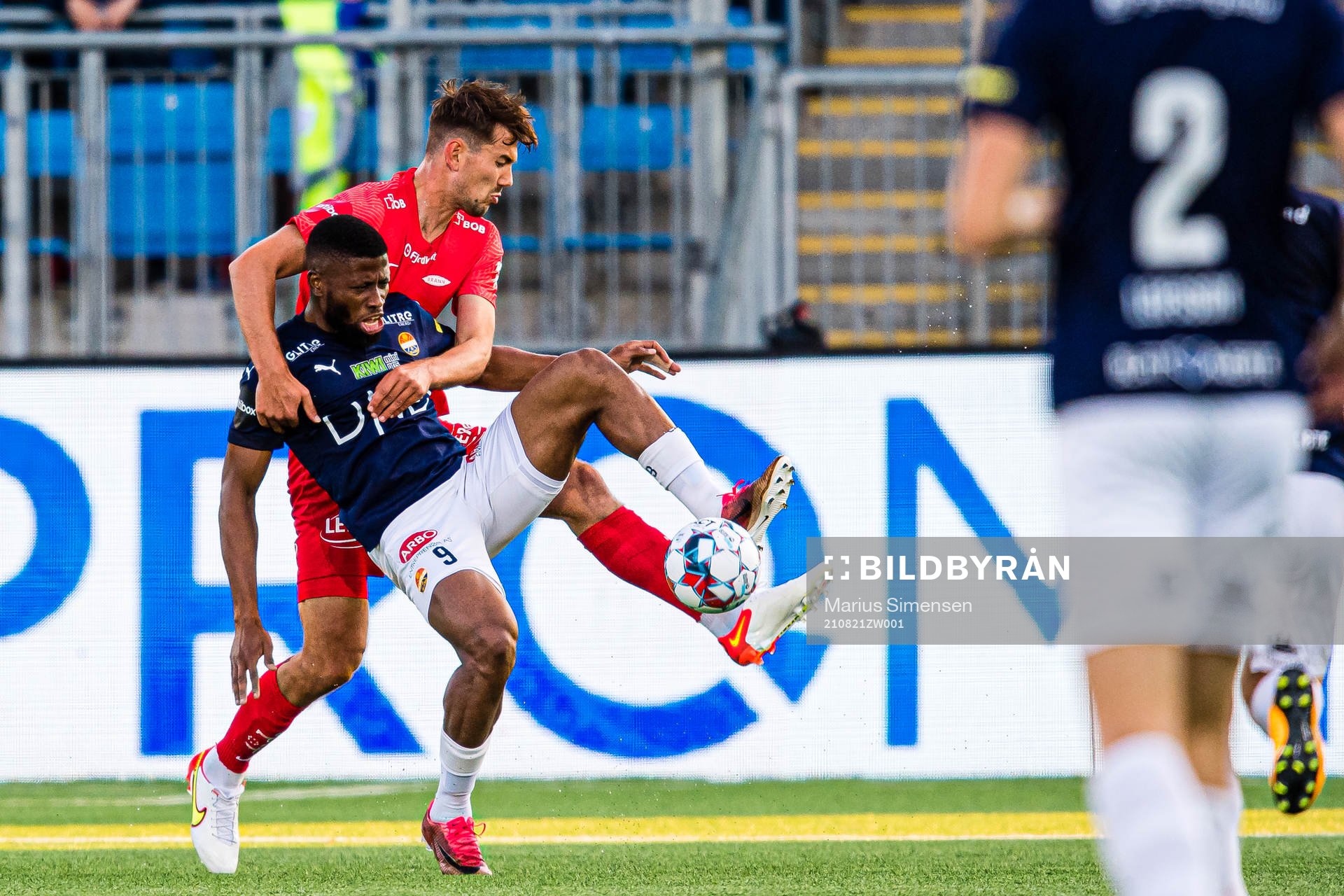 Fredrik Pallesen Knudsen of Brann and Imoh Fred Friday of Strømsgodset during the Eliteserien match between Strømsgodset and Brann on August 21, 2021 in Drammen.