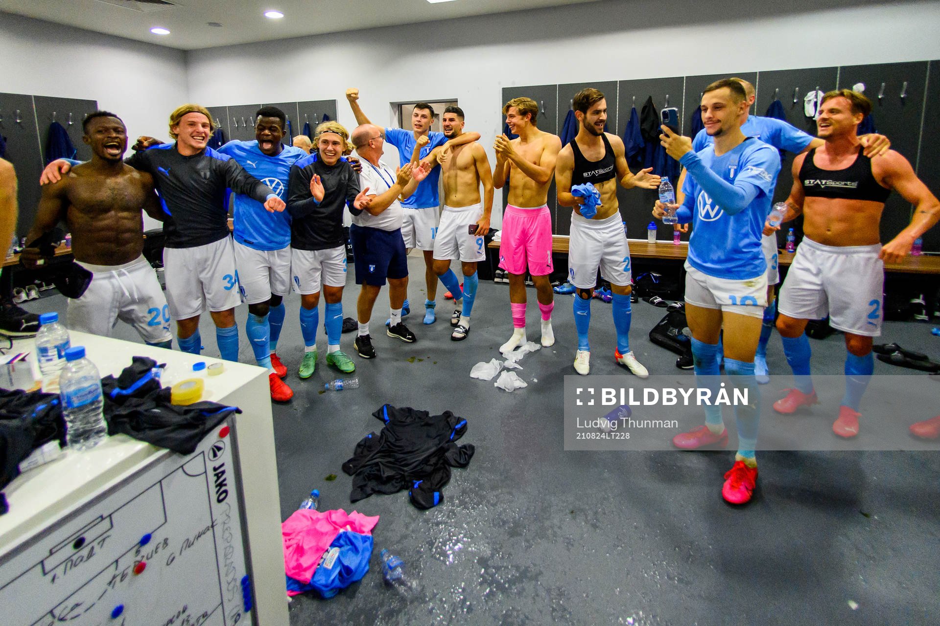 Players of Malmö FF celebrate in the locker room