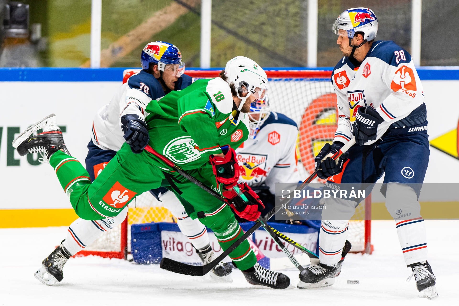 Dennis Everberg of Rögle compete with Maximilian Daubner