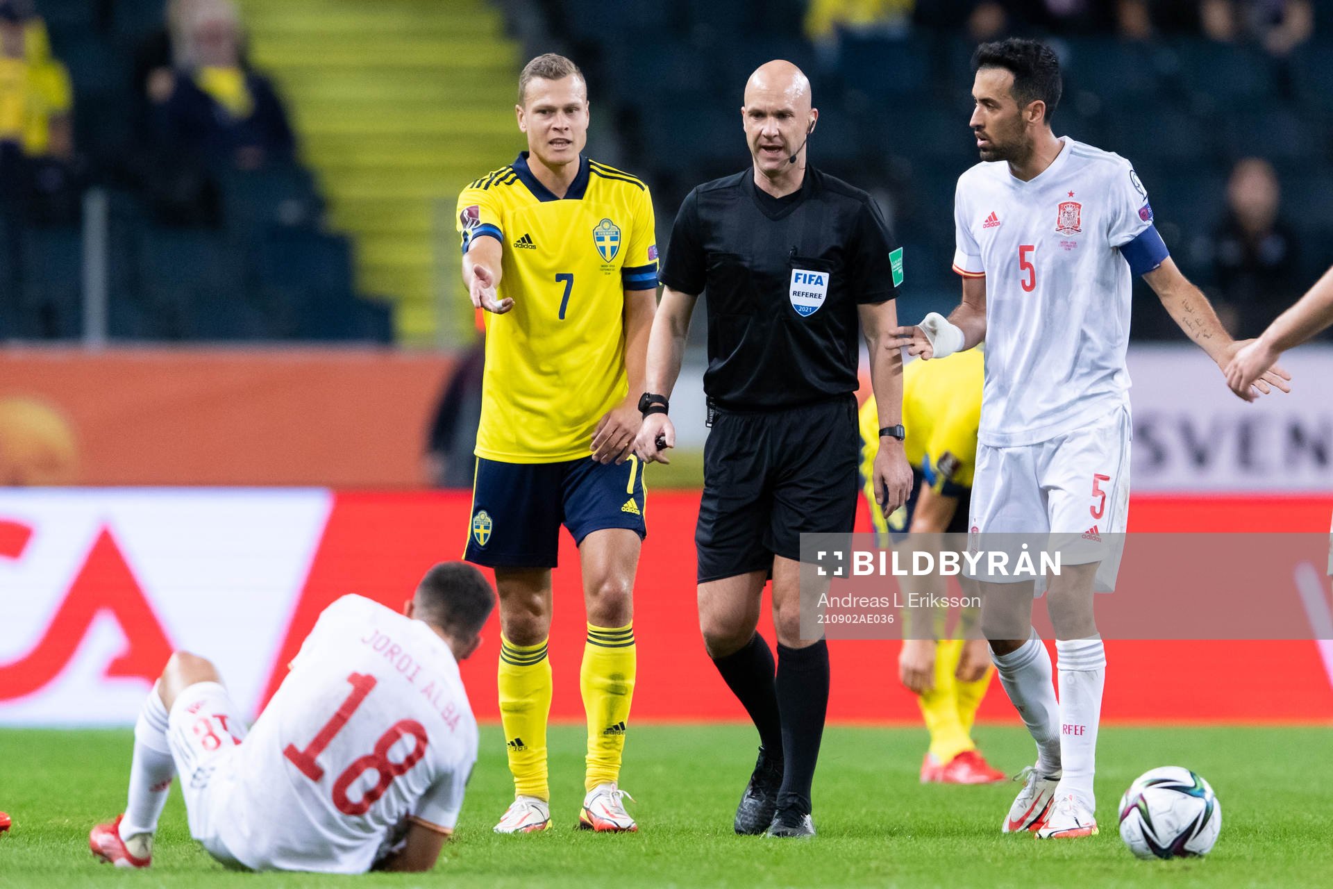 Jordi Alba of Spain, Viktor Claesson of Sweden and referee
