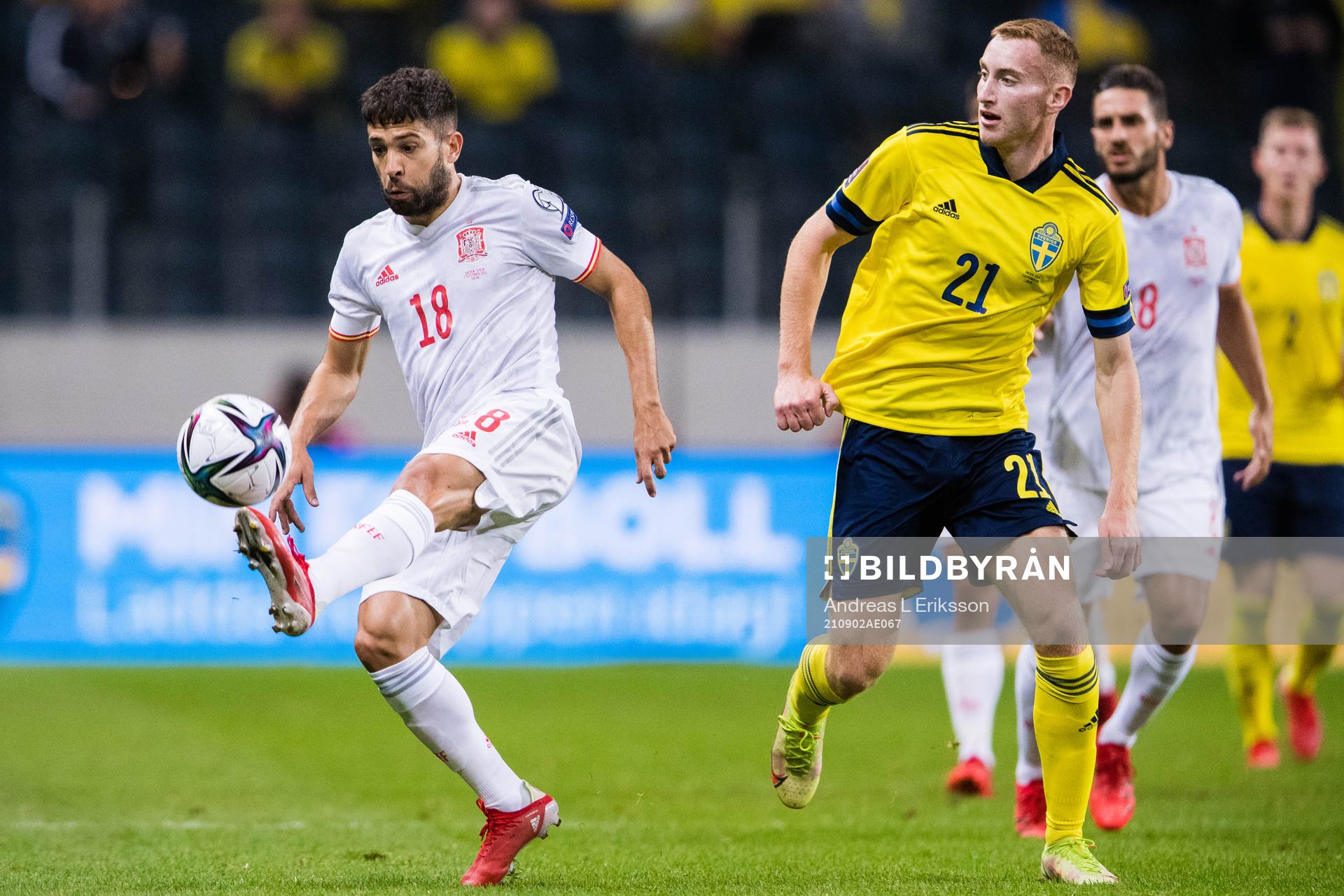 Jordi Alba of Spain and Dejan Kulusevski of Sweden