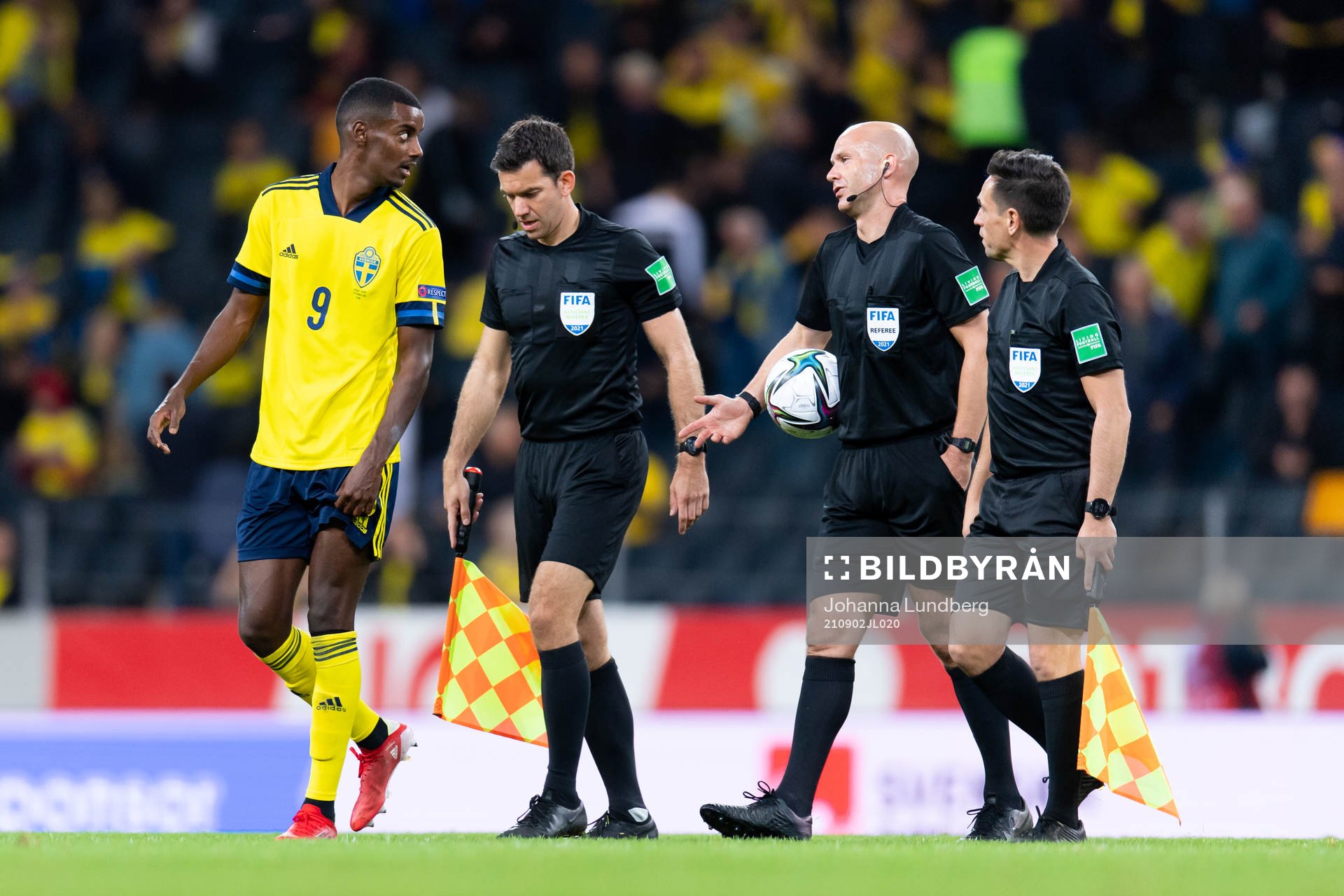 Alexander Isak of Sweden talks to referee Anthony Taylor