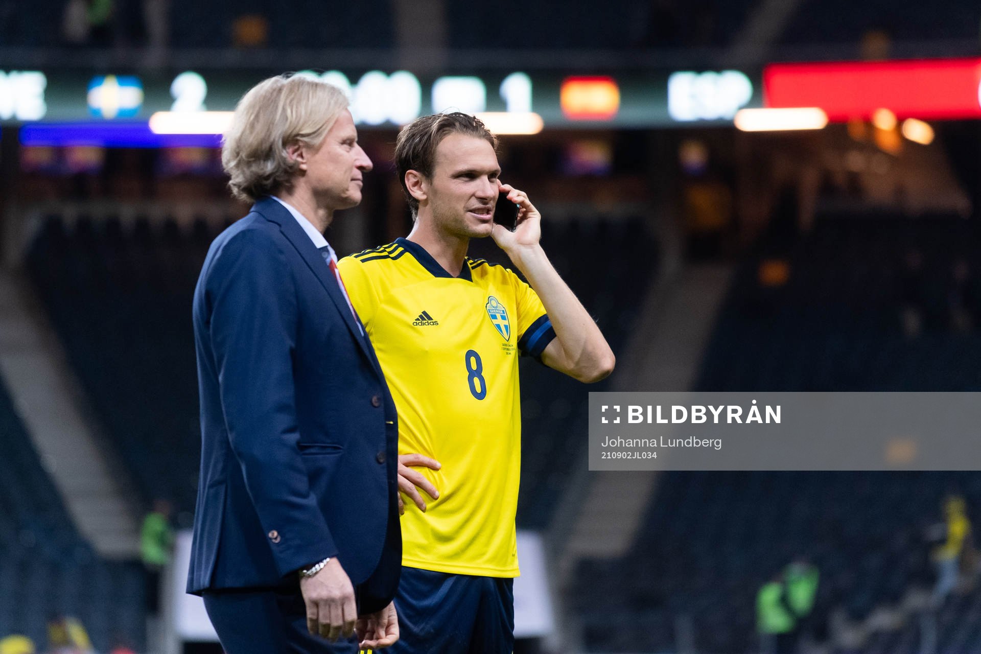 Team manager Stefan Pettersson and Albin Ekdal of Sweden talks on the phone after the FIFA World Cup Qualifier football match between Sweden and Spain on September 2, 2021 in Stockholm.