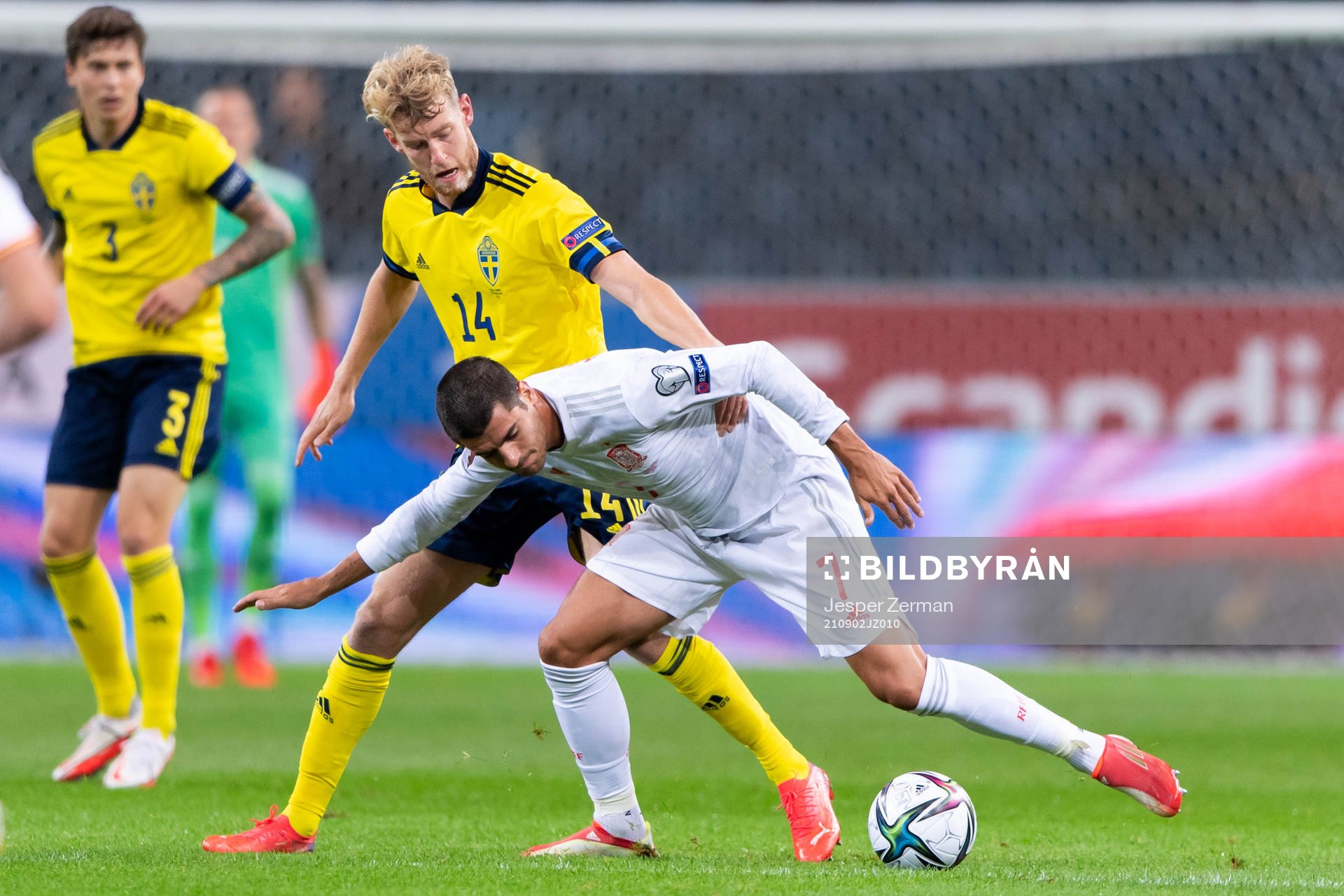 Filip Helander of Sweden and Alvaro Morata of Spain