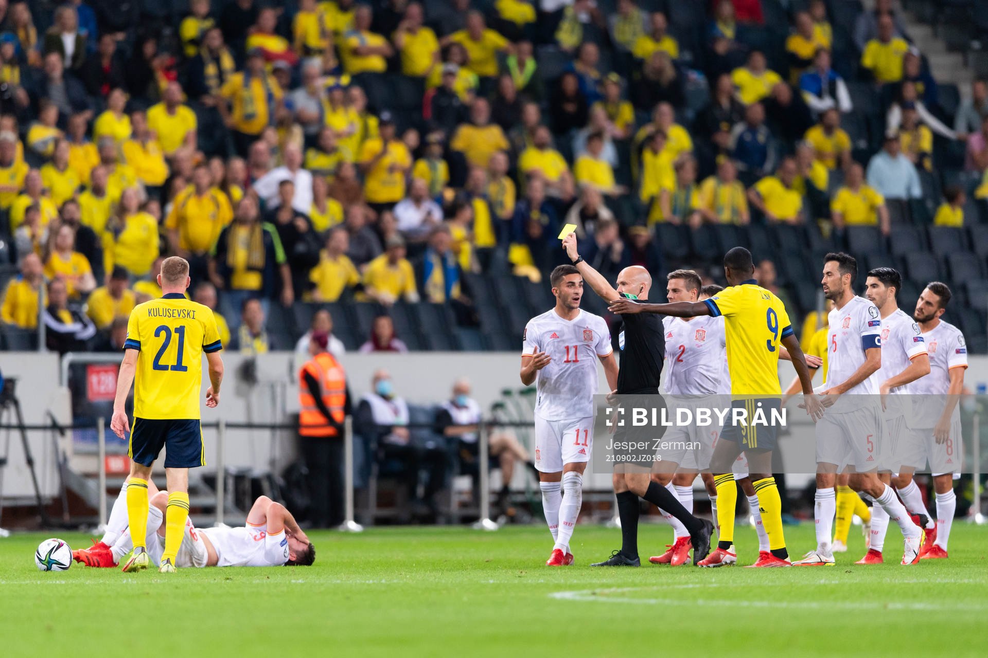 Dejan Kulusevski of Sweden is shown a yellow card