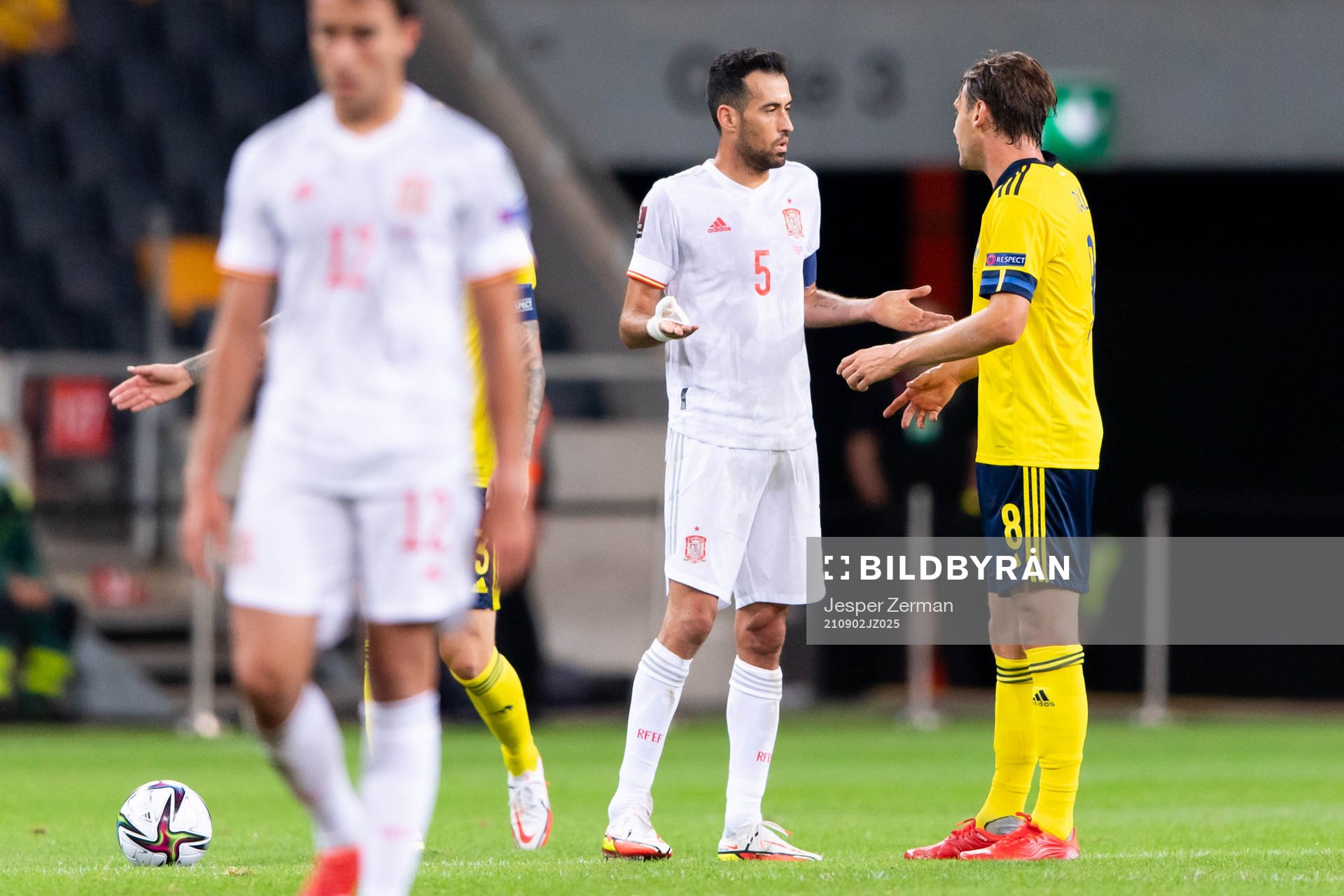 Sergio Busquets of Spain and Albin Ekdal of Sweden