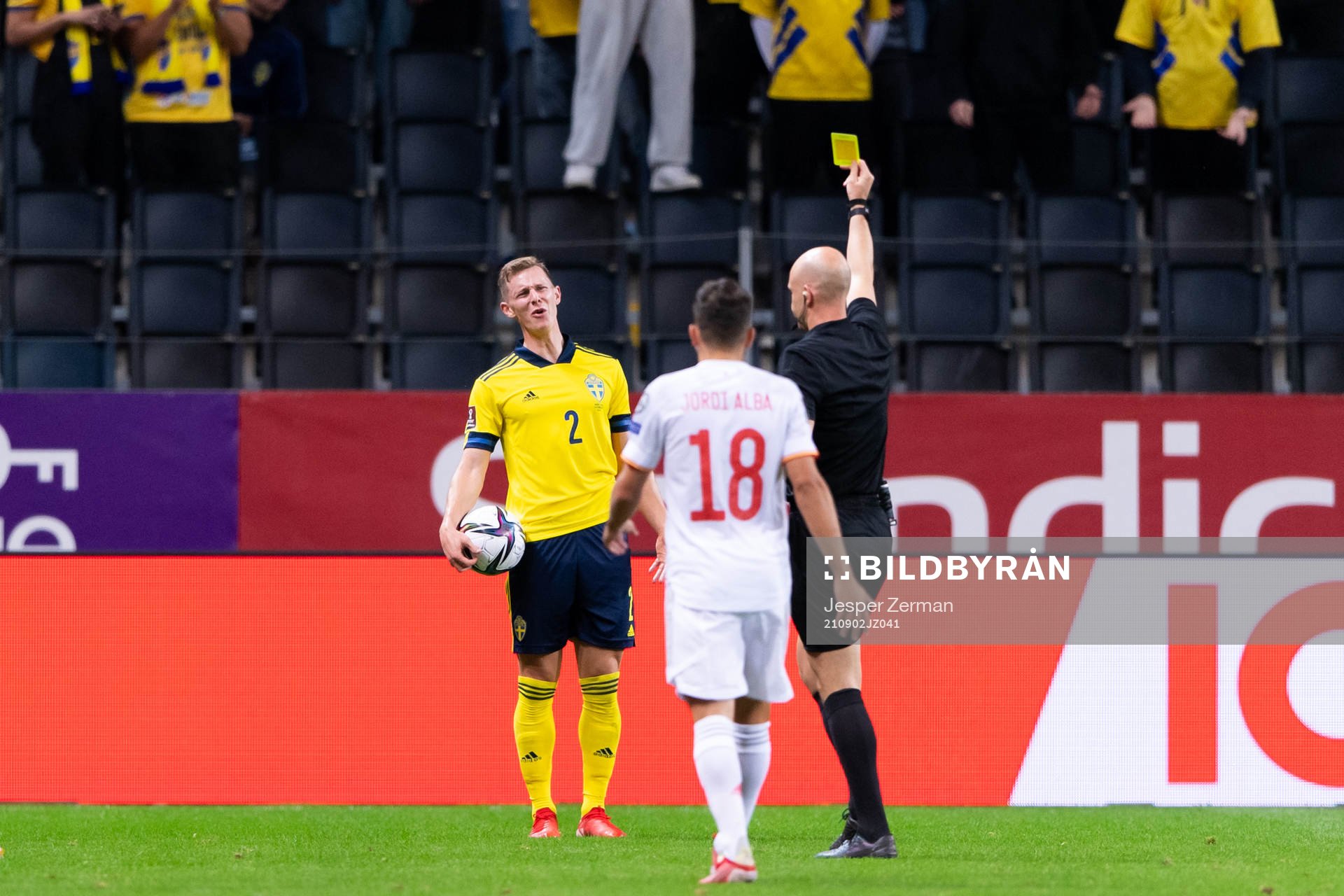 Emil Krafth of Sweden is shown a yellow card