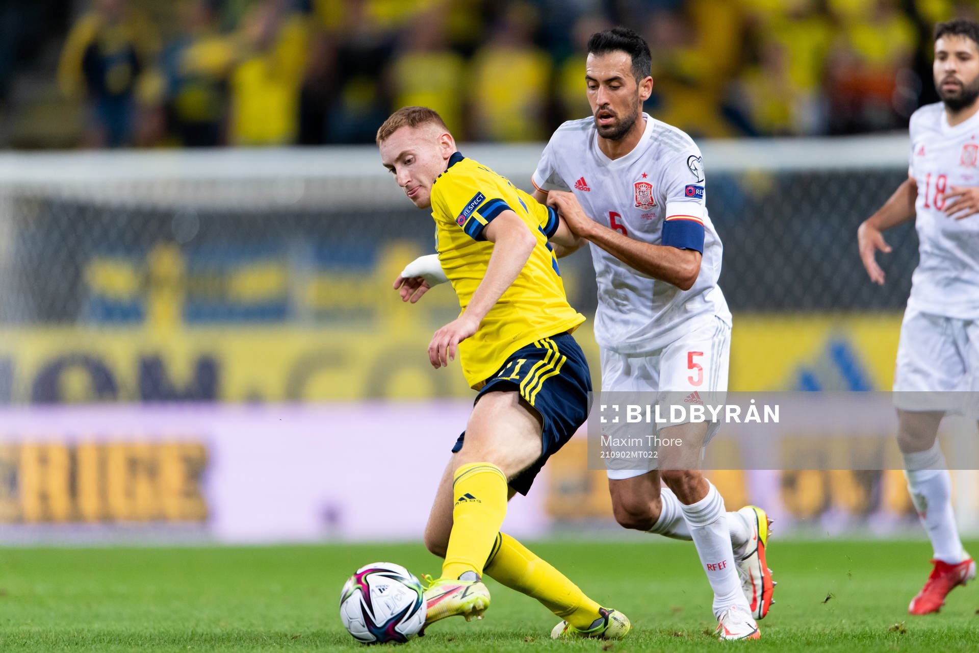 Dejan Kulusevski of Sweden and Sergio Busquets of Spain