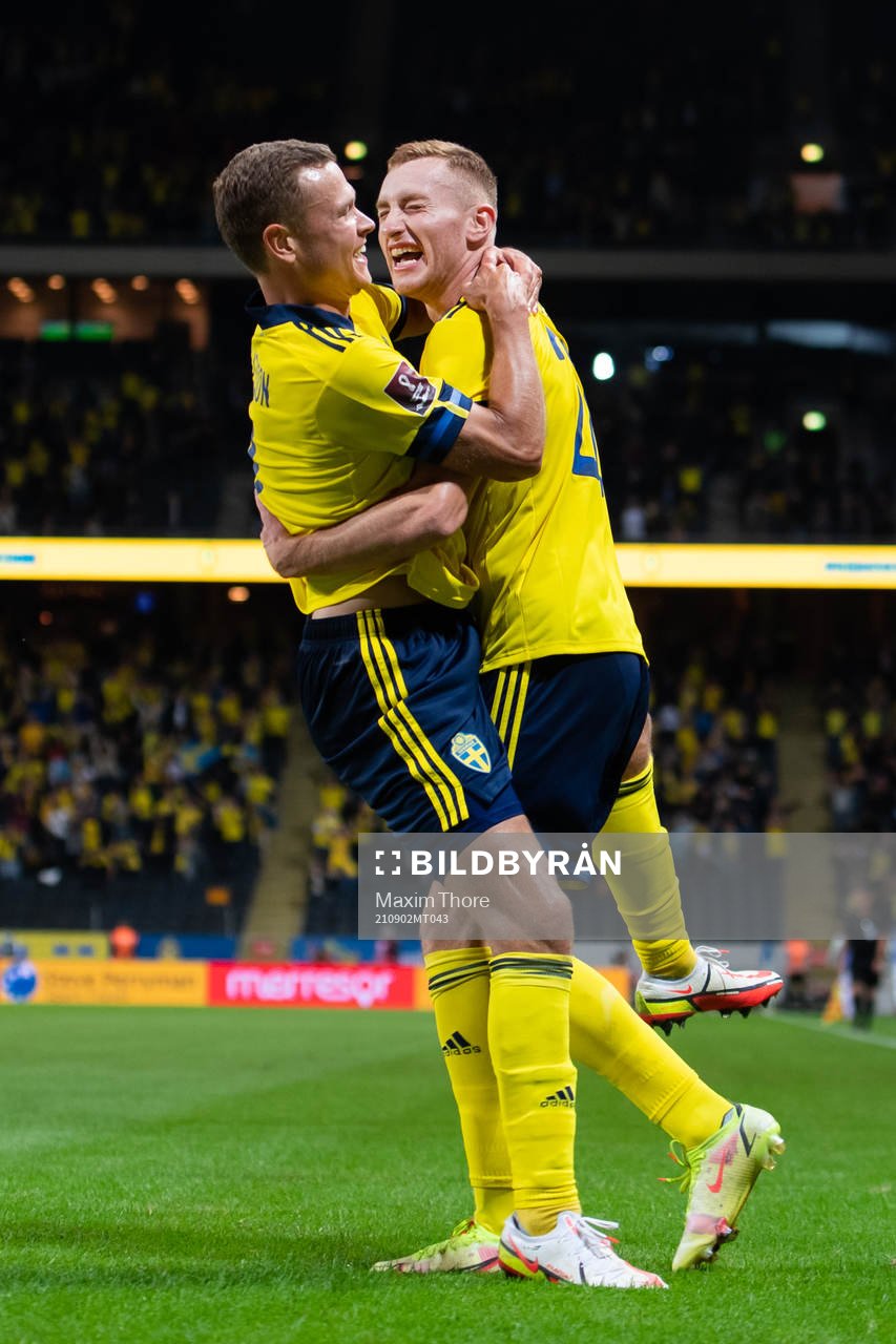 Viktor Claesson and Dejan Kulusevski of Sweden celebrate
