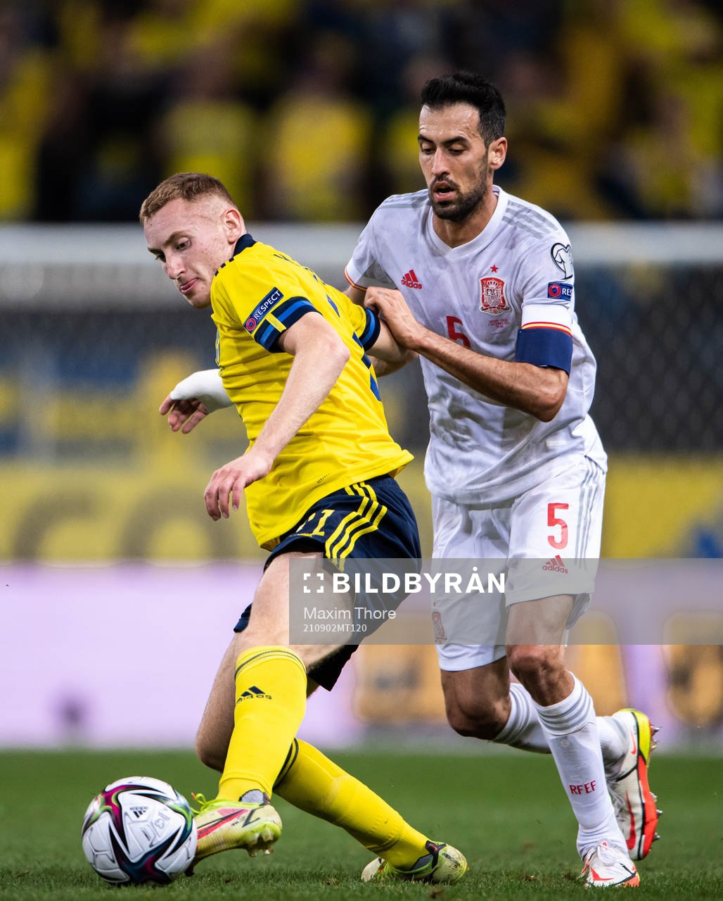 Dejan Kulusevski of Sweden and Sergio Busquets of Spain