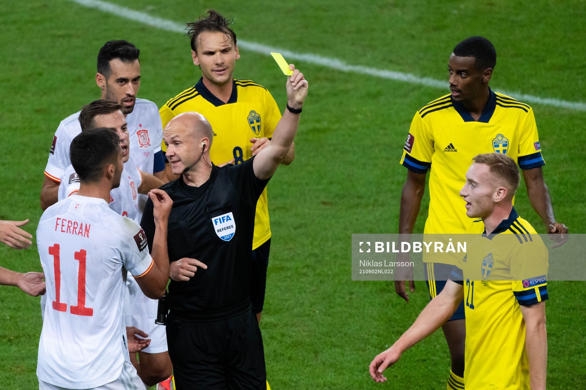 Dejan Kulusevski of Sweden is shown a yellow card