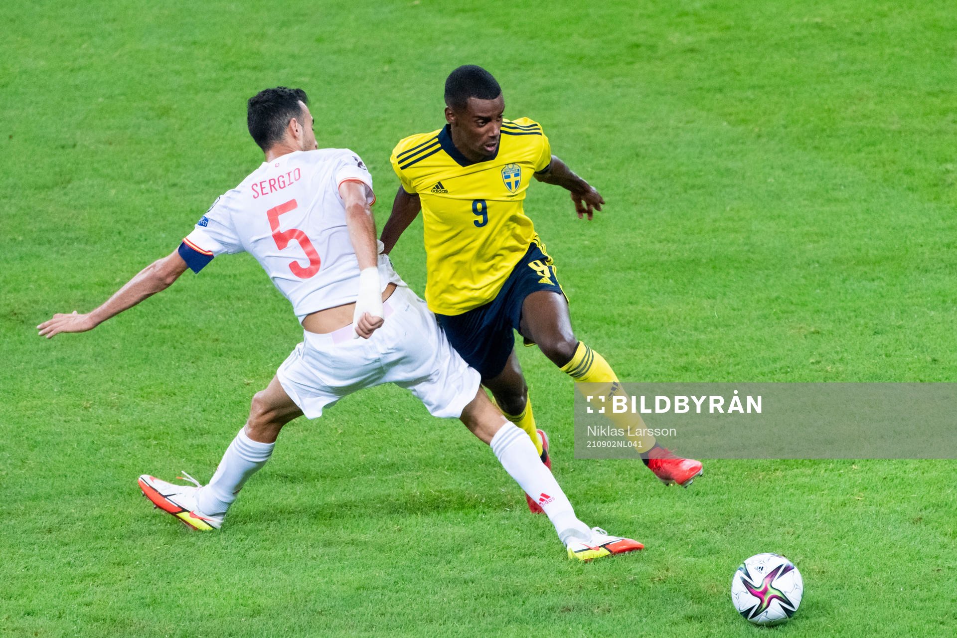 Sergio Busquets of Spain and Alexander Isak of Sweden