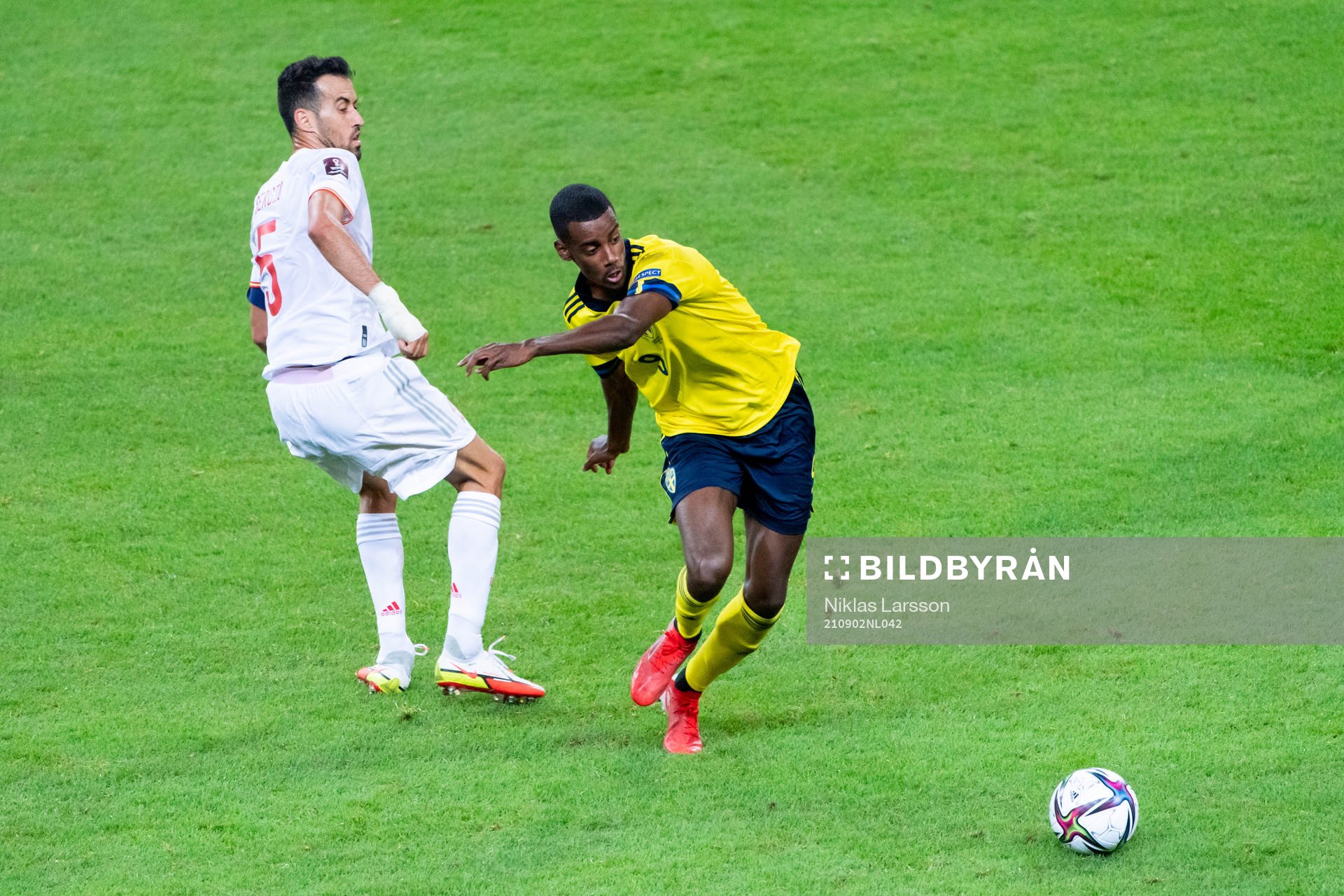 Sergio Busquets of Spain and Alexander Isak of Sweden