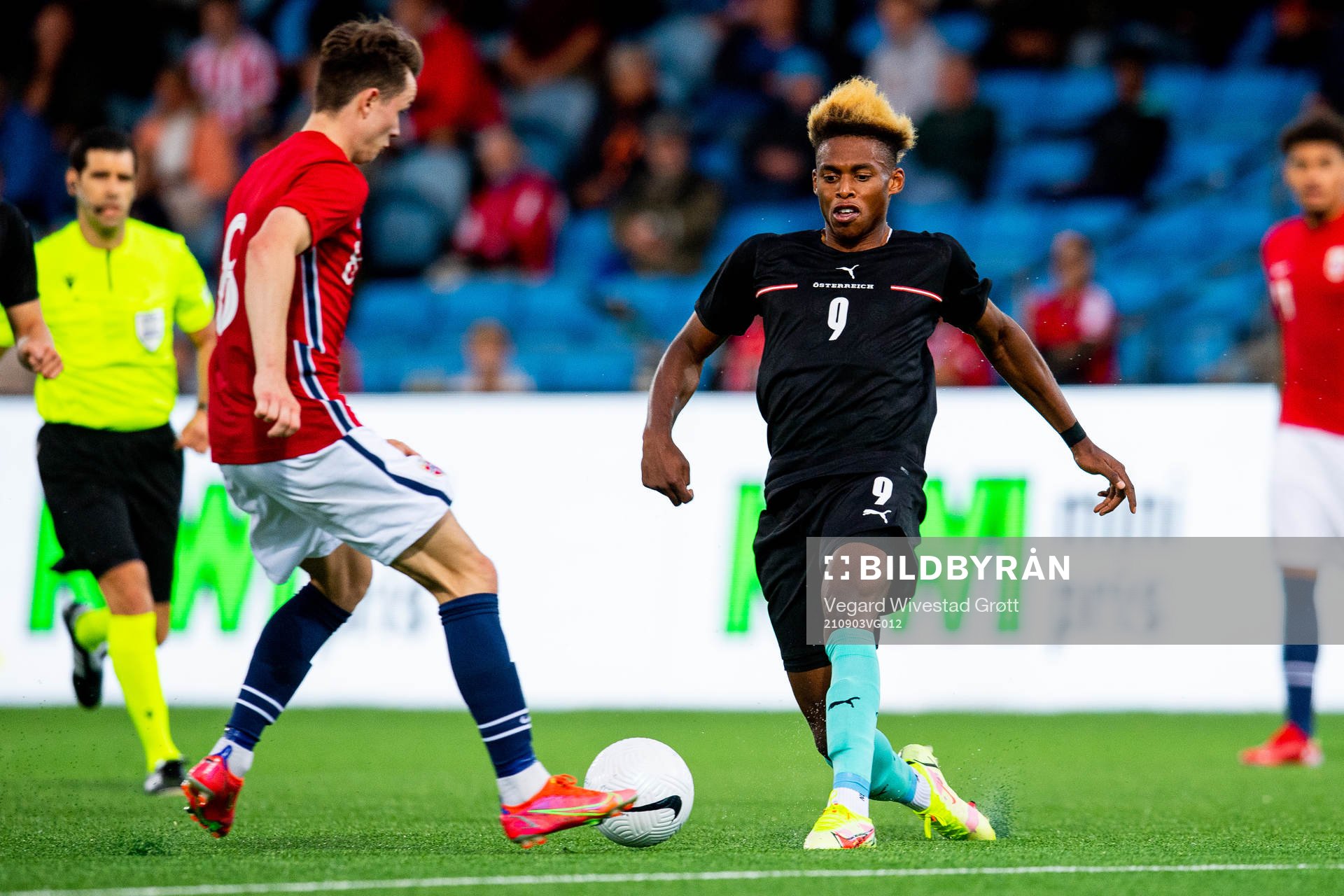 Håkon Evjen of Norway and Junior Adamu of Austria