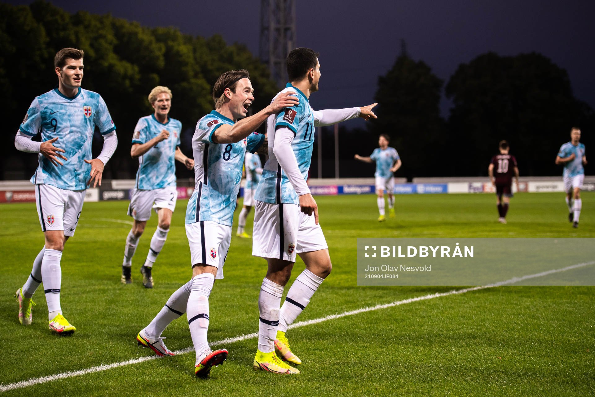 Alexander Sørloth and Patrick Berg celebrate with Mohamed Elyounoussi of Norway after the 0-2 goal during the FIFA World Cup Qualifier football match between Latvia and Norway on September 4, 2021 in Riga.