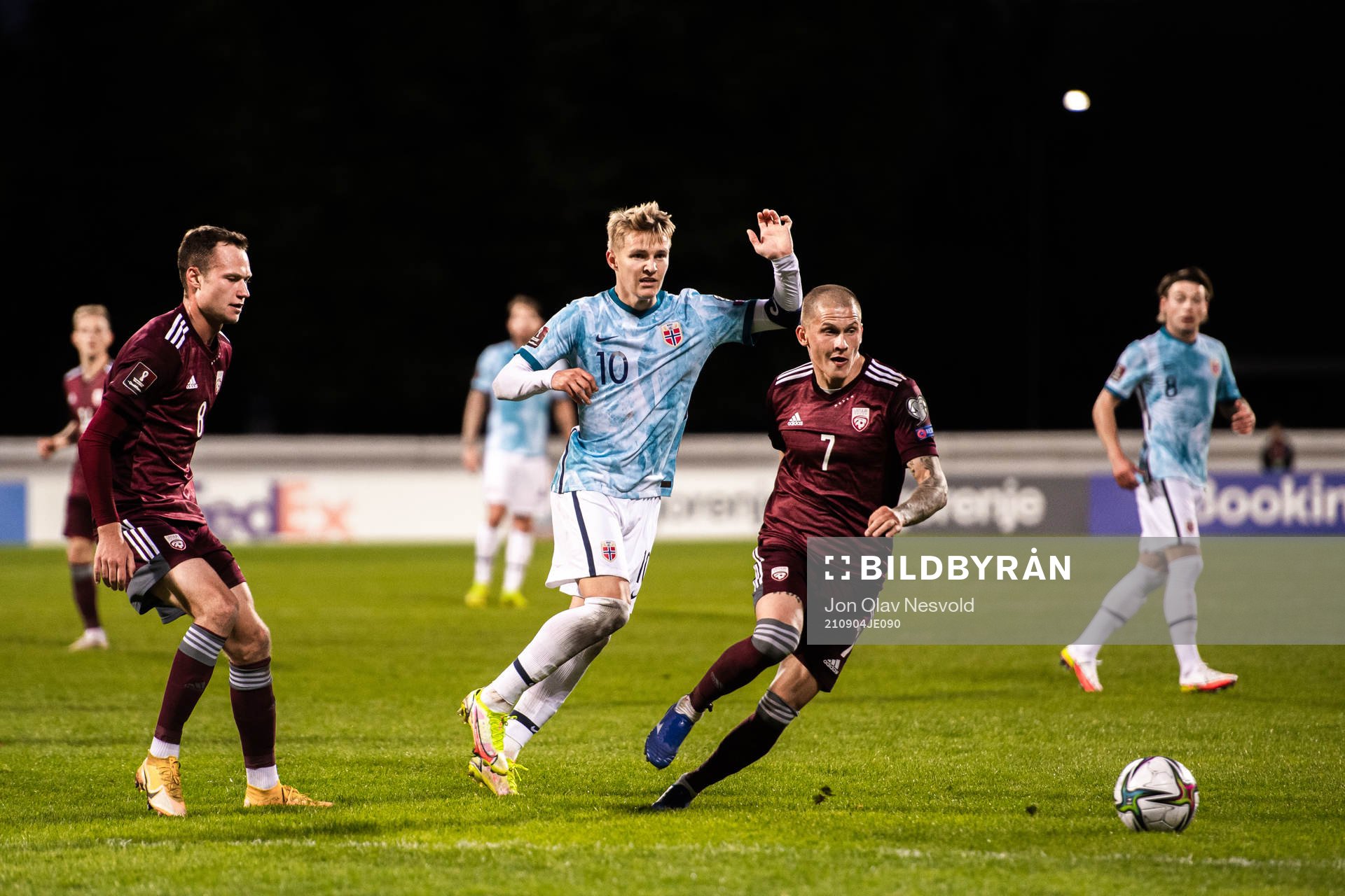 Martin Ødegaard of Norway and Vladimirs Kamess of Latvia