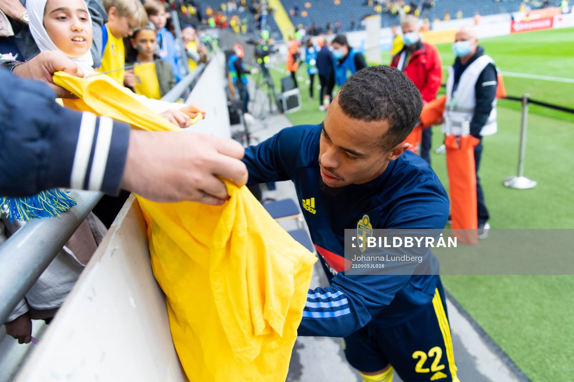 Robin Quaison of Sweden signs a shirt