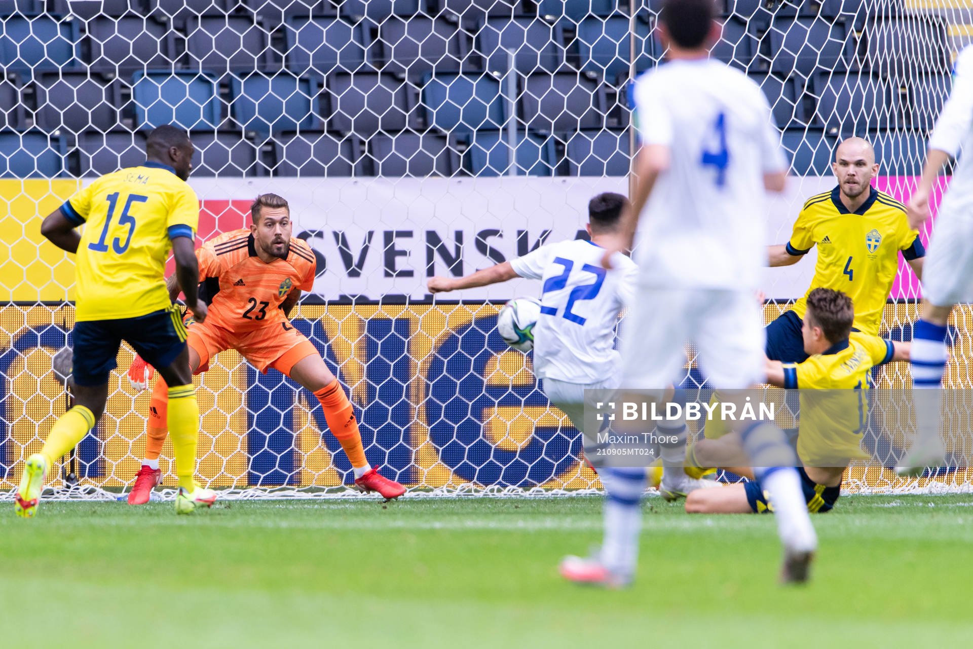 Goalkeeper Kristoffer Nordfeldt of Sweden, Oybek Bozorov of