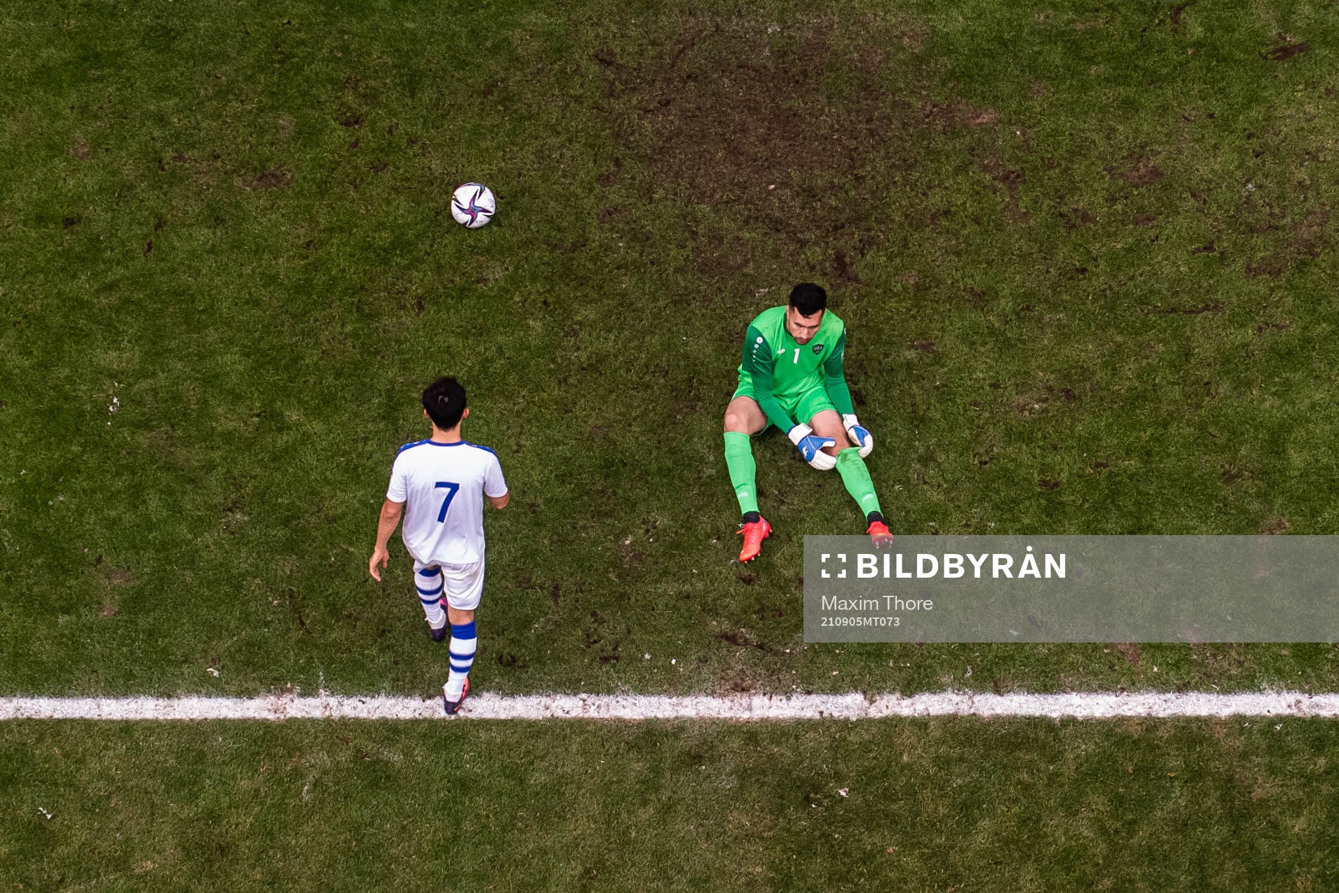 Dostonbek Tursunov and goalkeeper Eldorbek Suyunov of