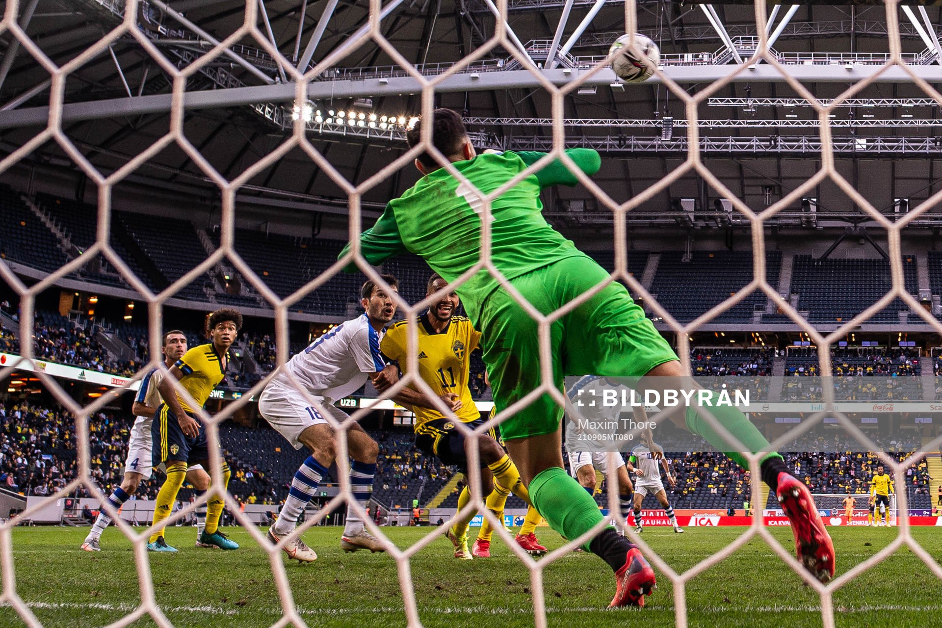Goalkeeper Eldorbek Suyunov of Uzbekistan with a save in