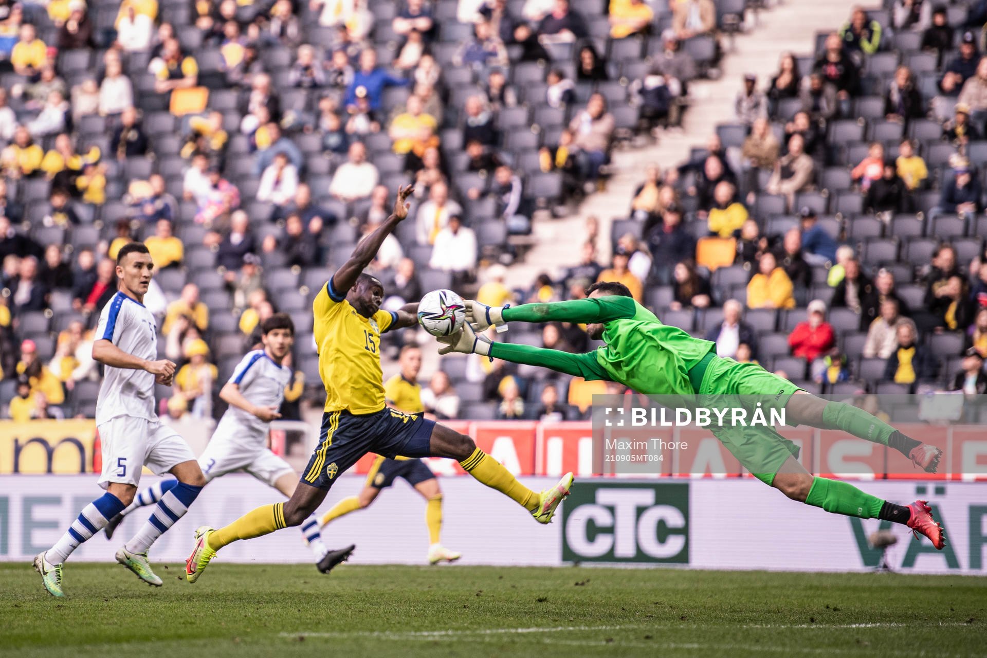 Ken Sema of Sweden and goalkeeper Eldorbek Suyunov of