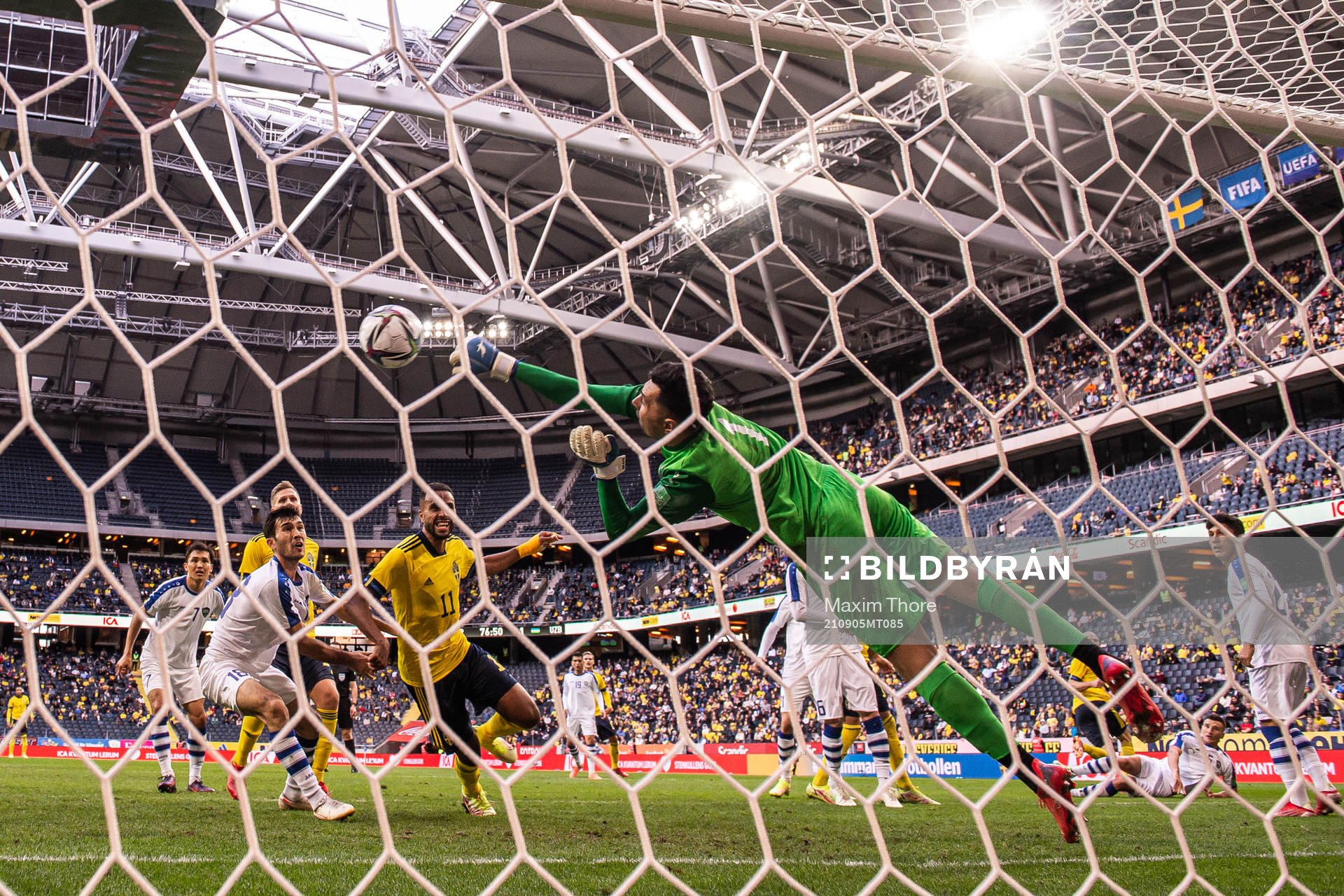 Goalkeeper Eldorbek Suyunov of Uzbekistan with a save in