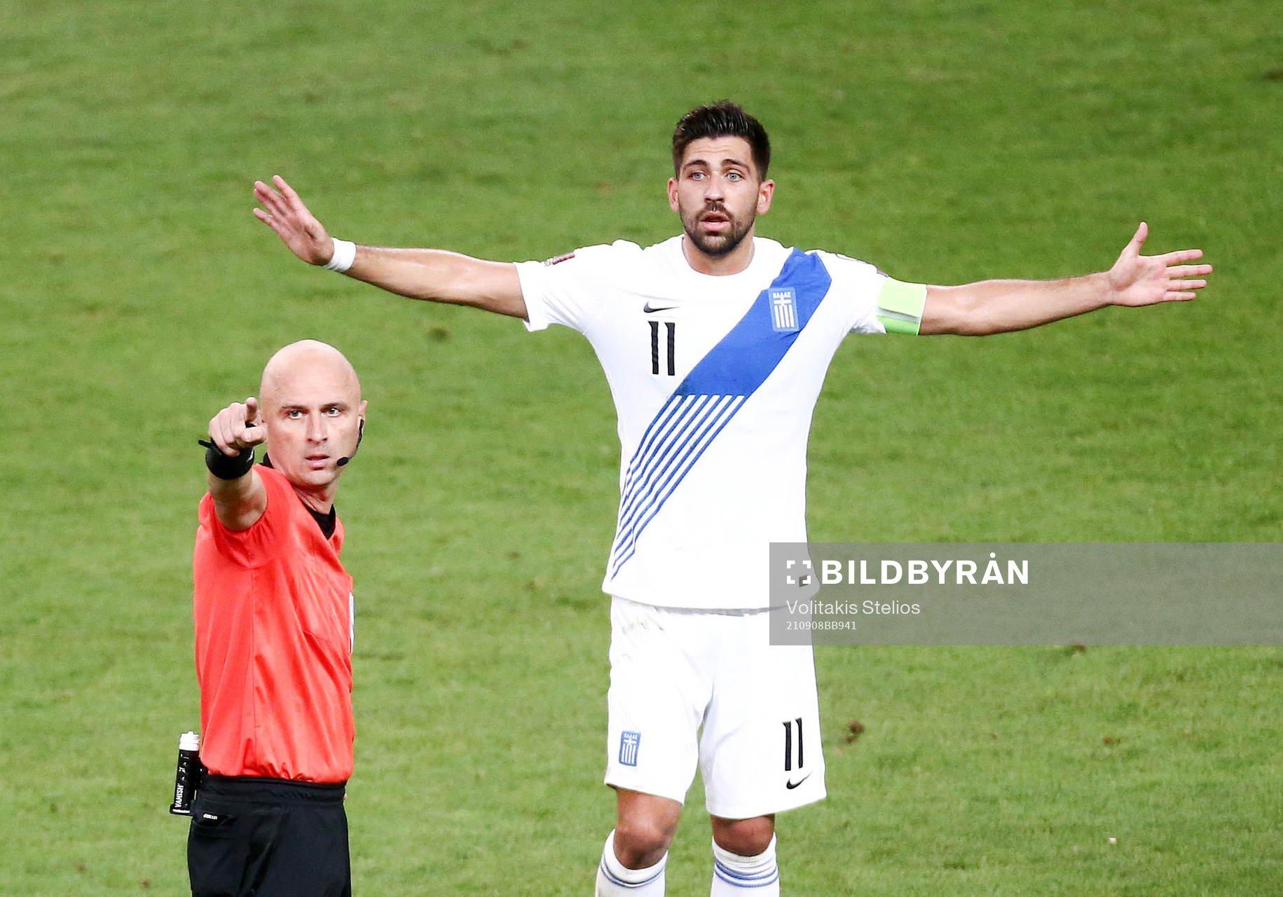 Referee Sergei Karasev and Tasos Bakasetas of Greece