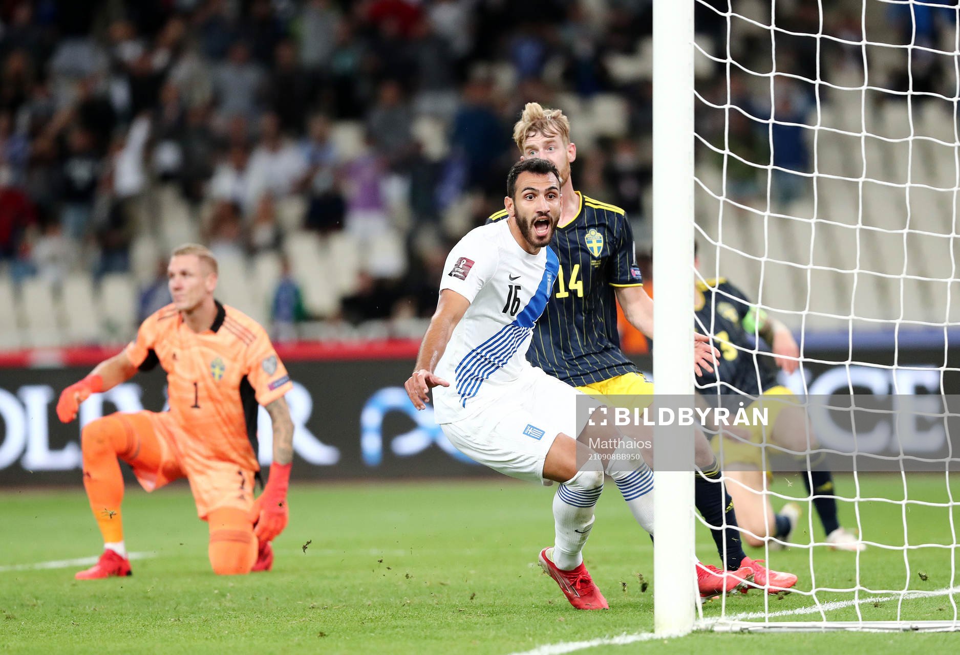 Filip Helander of Sweden sees Vangelis Pavlidis of Greece