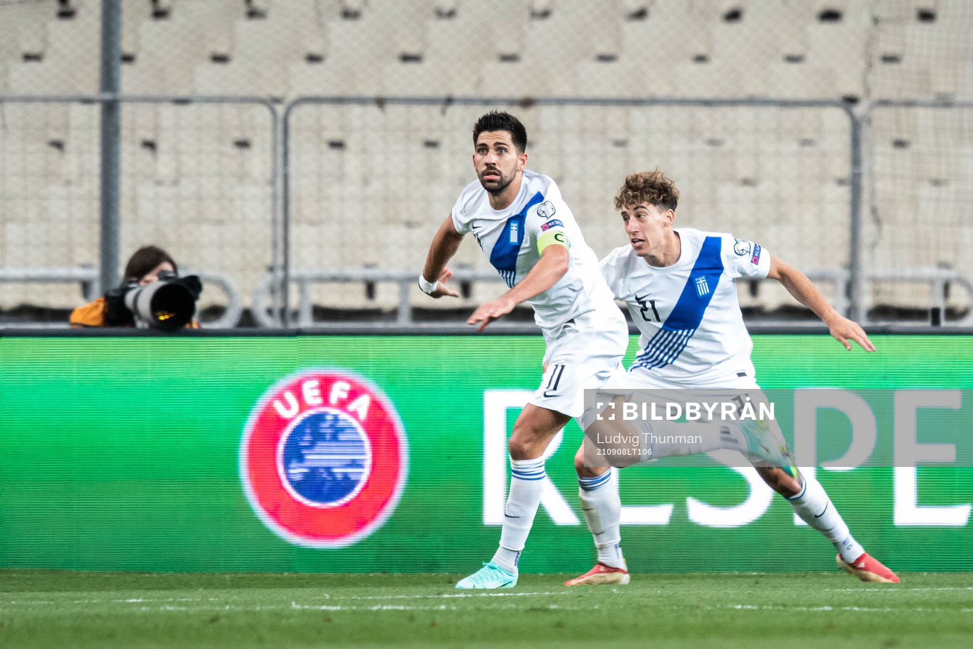 Tasos Bakasetas and Kostas Tsimikas of Greece celebrate the