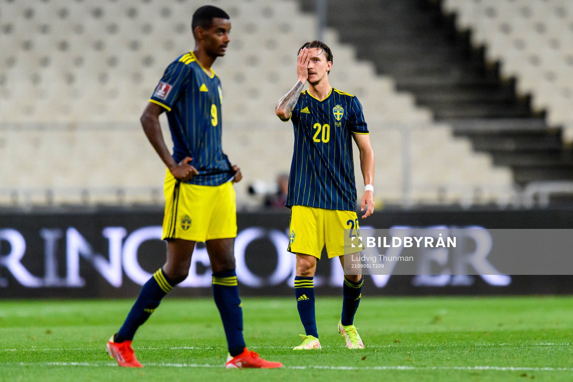 Alexander Isak and Kristoffer Olsson of Sweden looks