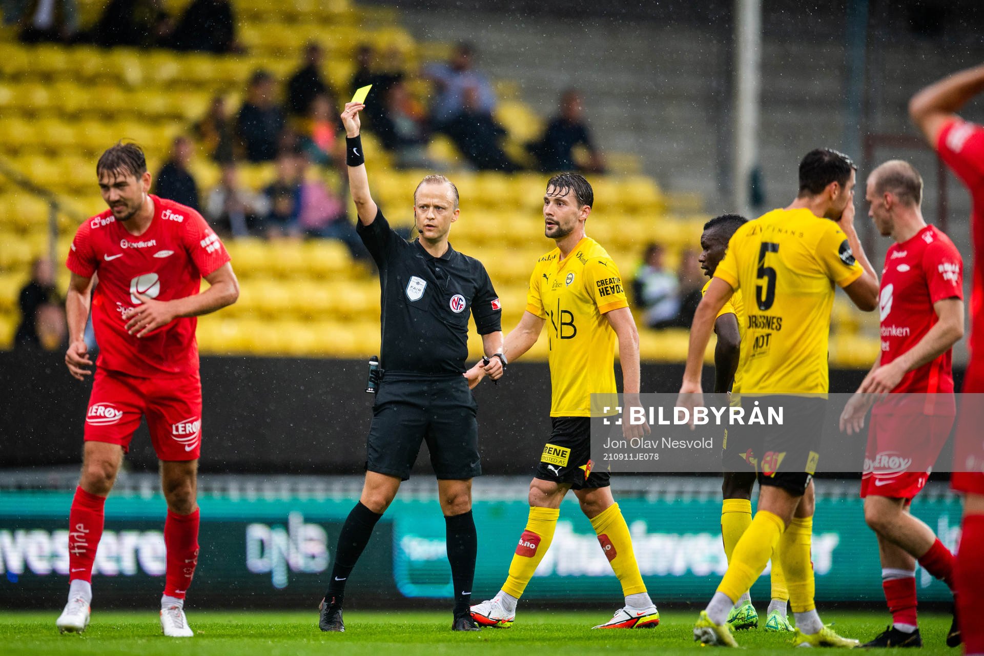 Fredrik Pallesen Knudsen of Brann is shown a yellow card