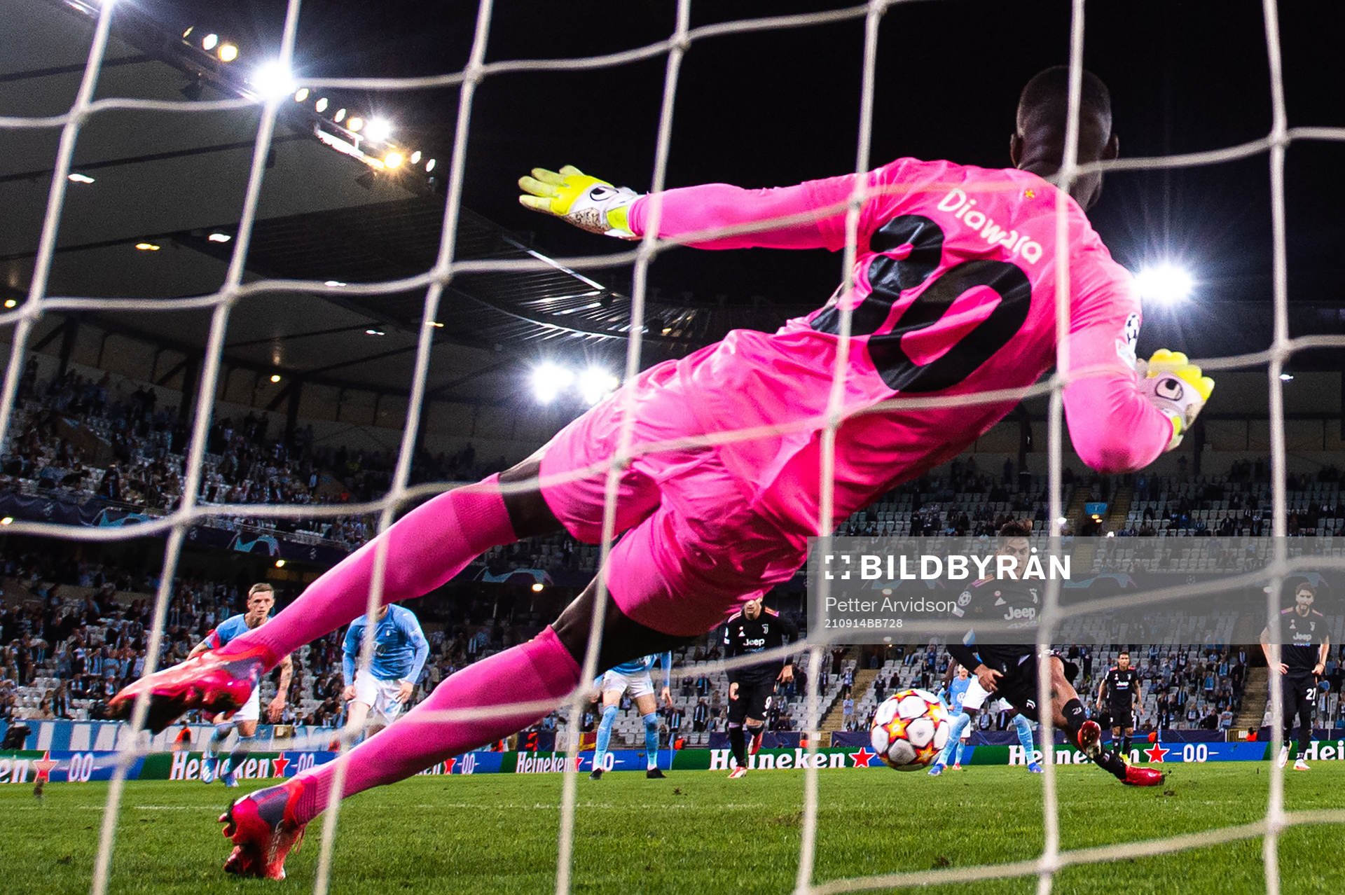 Paulo Dybala of Juventus scores a penalty behind goalkeeper