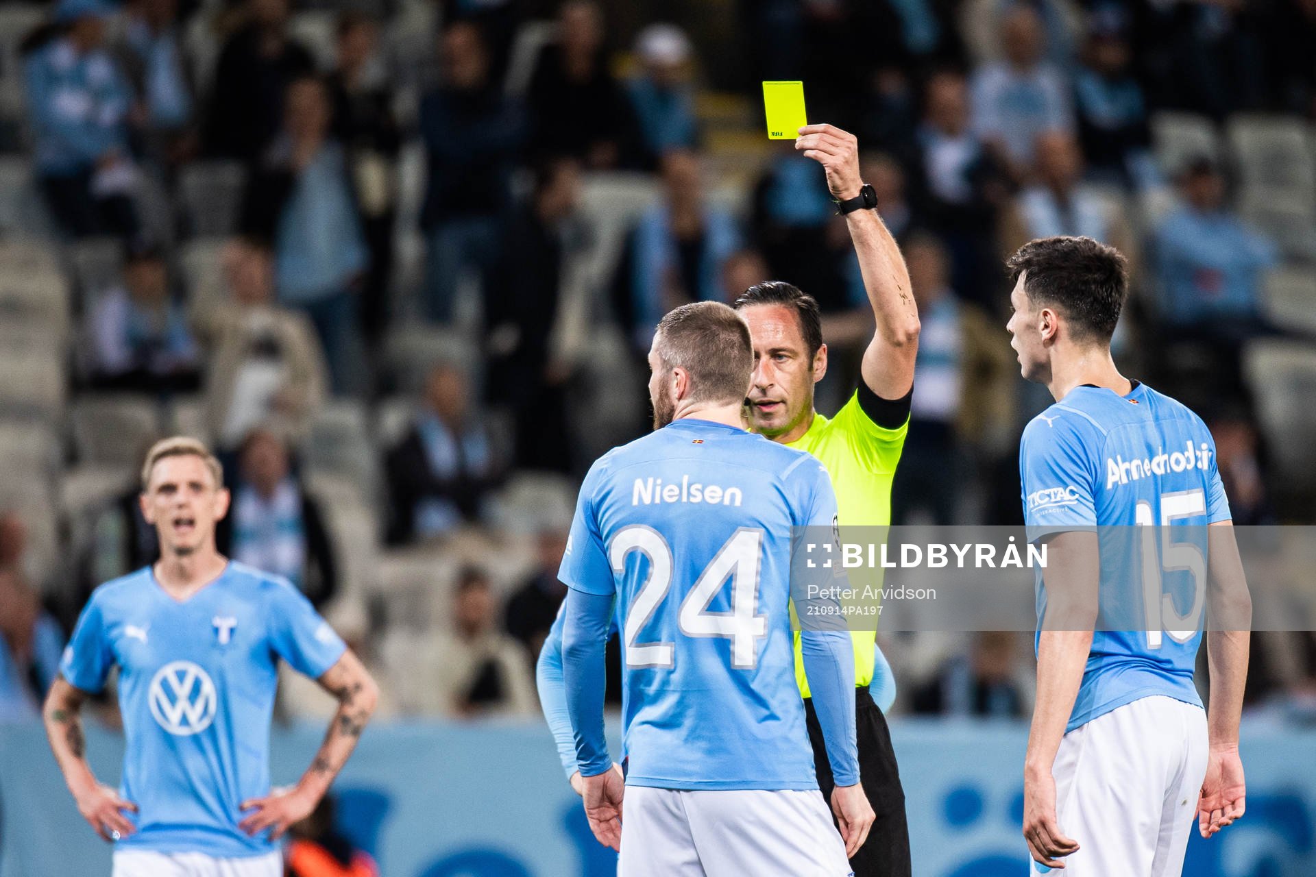 Lasse Nielsen of Malmö FF receives a warning from referee