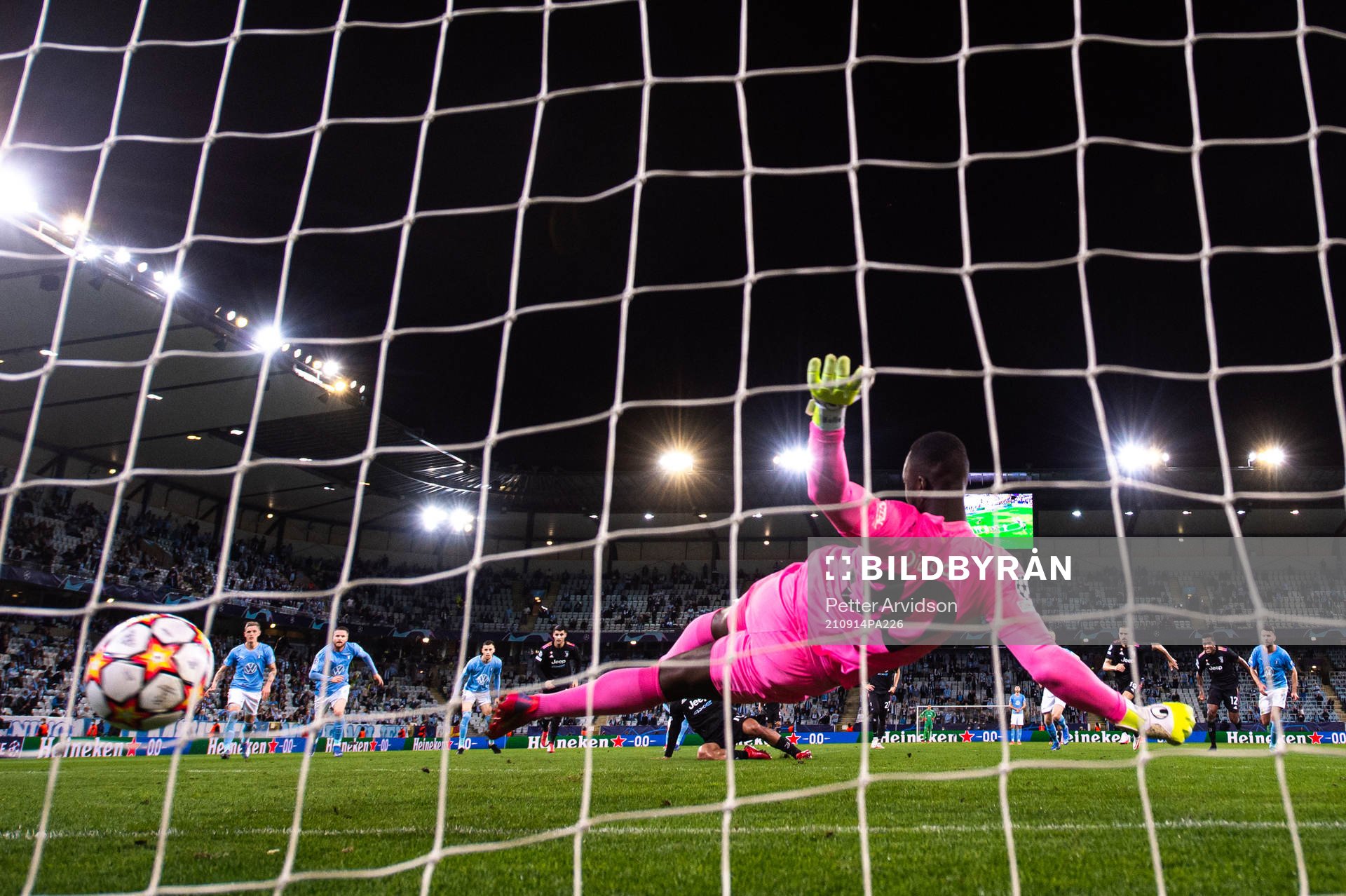 Paulo Dybala of Juventus scores a penalty behind goalkeeper