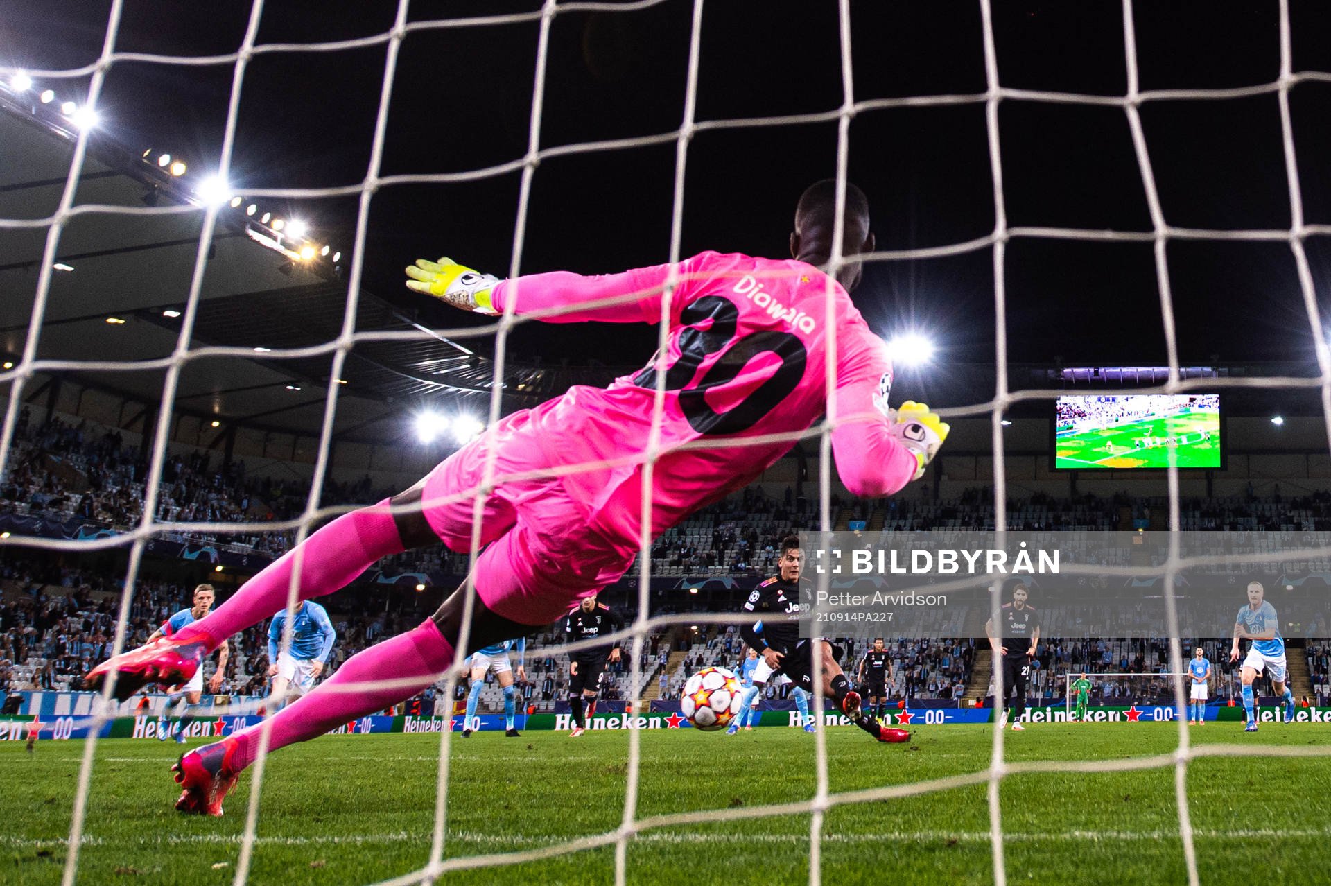 Paulo Dybala of Juventus scores a penalty behind goalkeeper