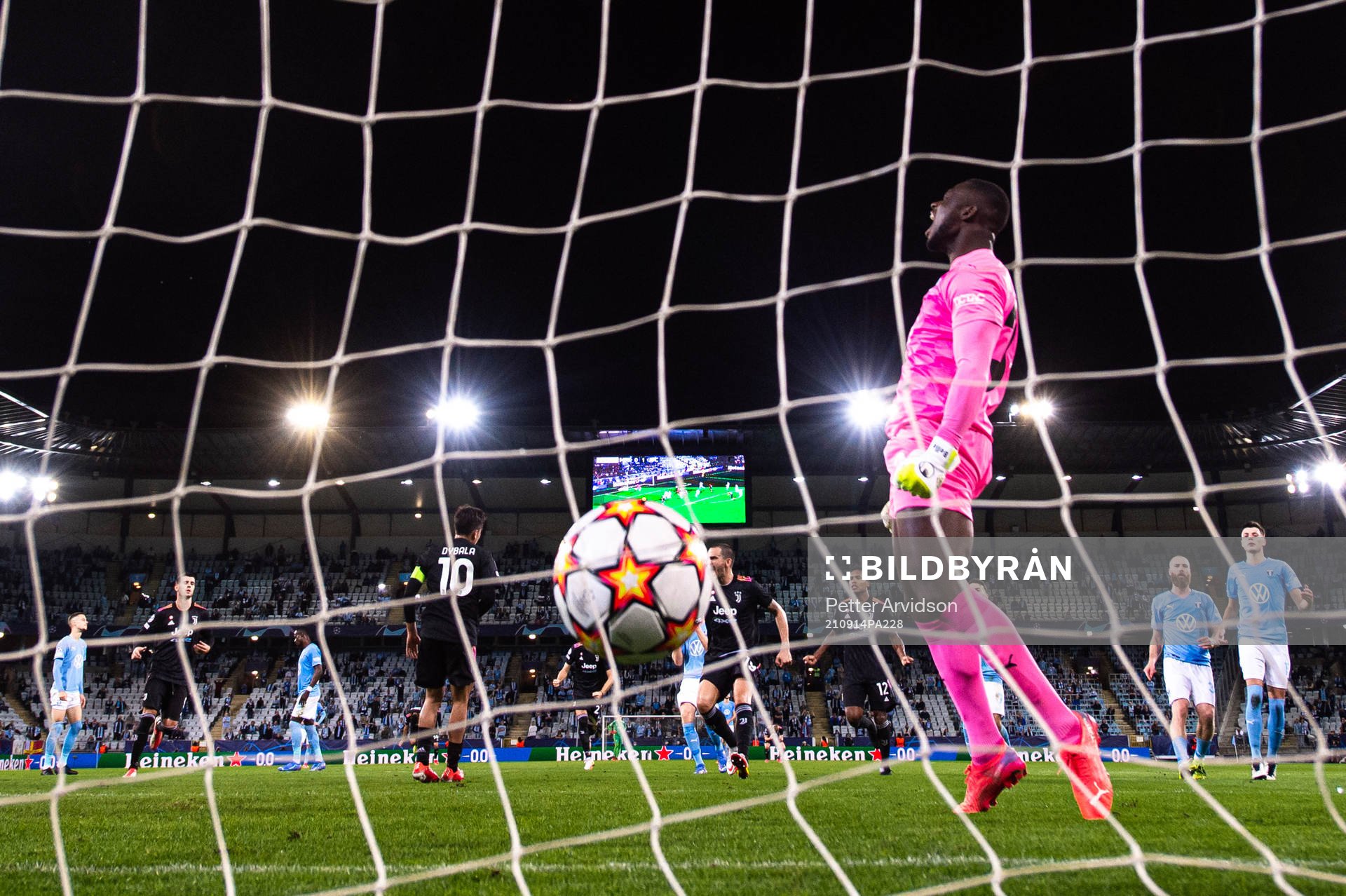 Paulo Dybala of Juventus scores a penalty behind goalkeeper